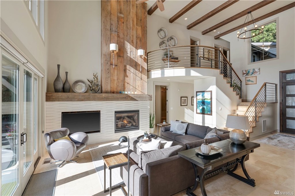 Relax in the living area with a gas fireplace and a luxurious sectional that seats eight adults.