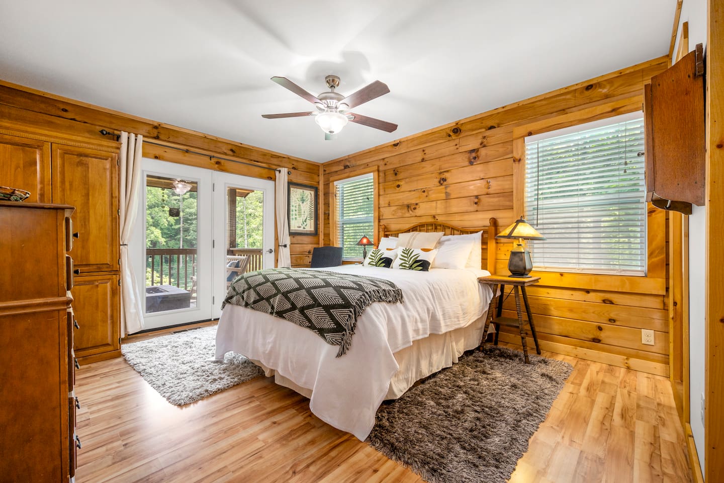 Bedroom #1 located on the main level of the cabin with queen bed and en suite bathroom