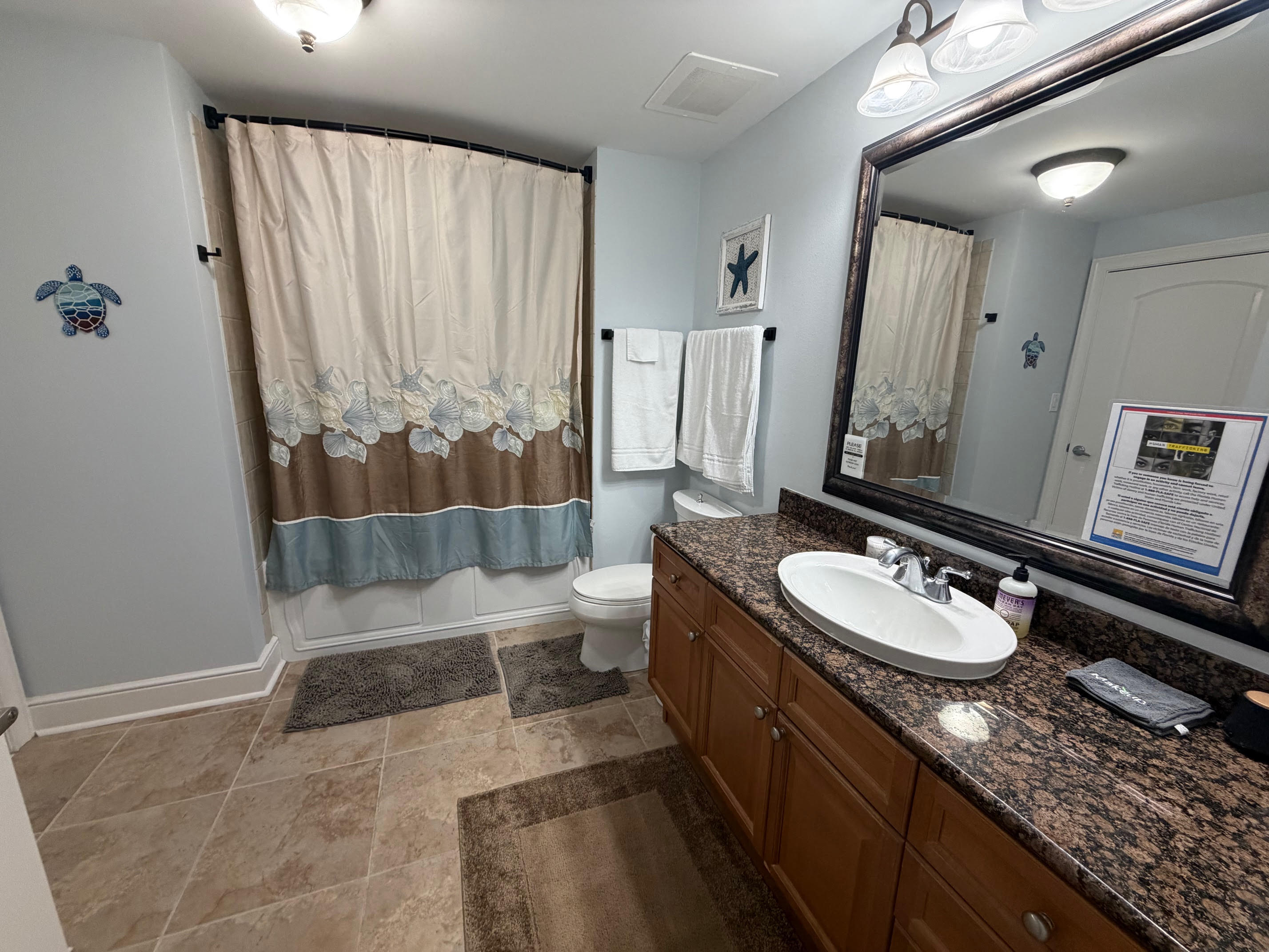 A bright, well-kept guest bathroom with everything your family needs for a comfortable stay.