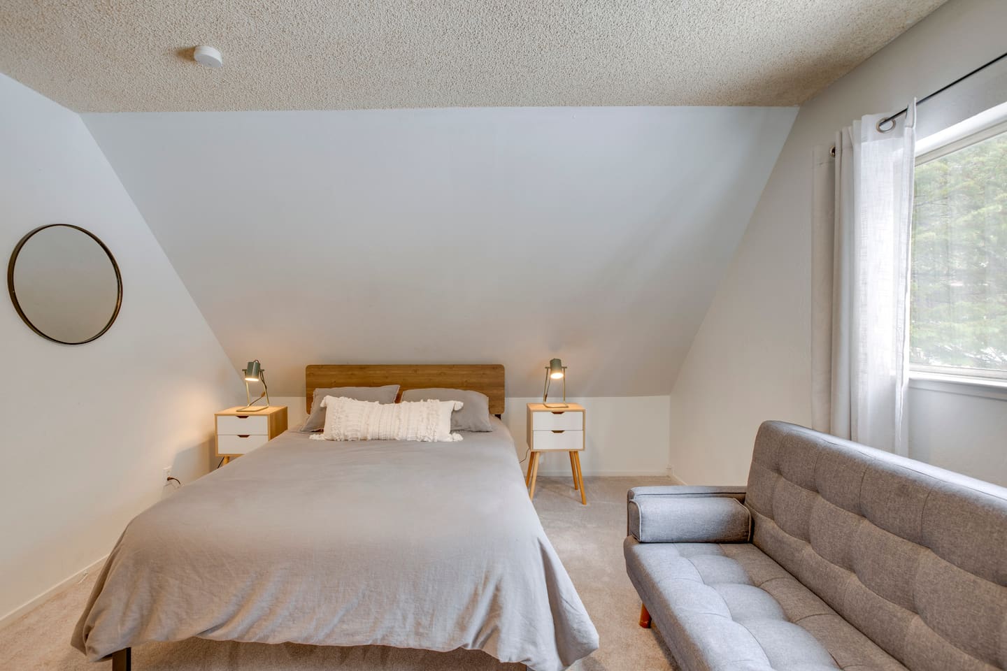 cozy sleeping space in one of the upstairs bedrooms.