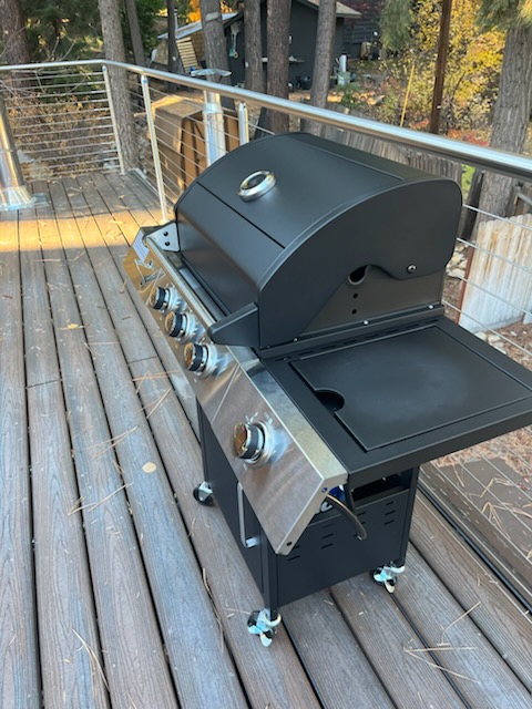 Private outdoor gas grill on mountain cabin deck, perfect for BBQ and outdoor dining