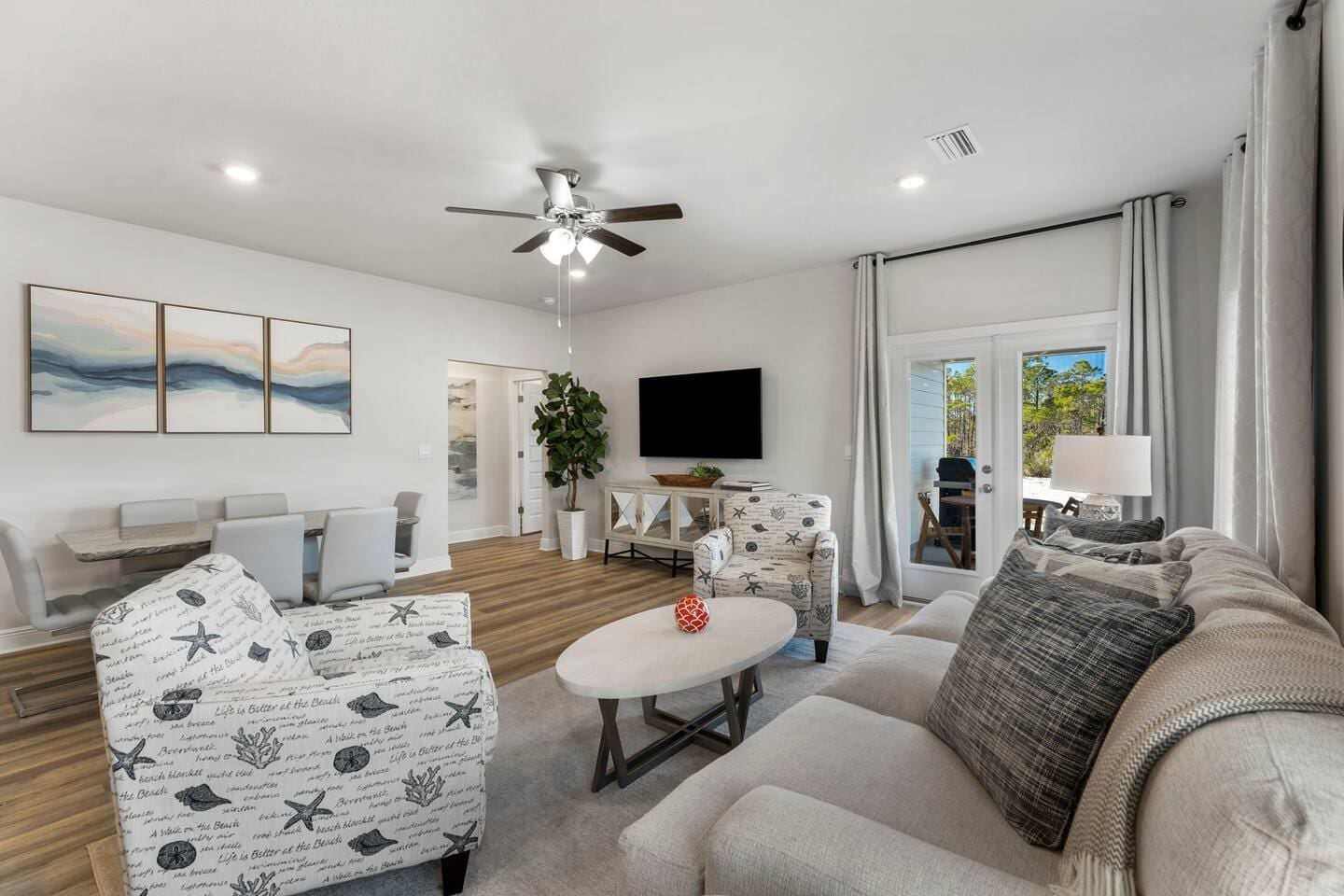 An open living space designed for connection, flowing seamlessly into the dining area.