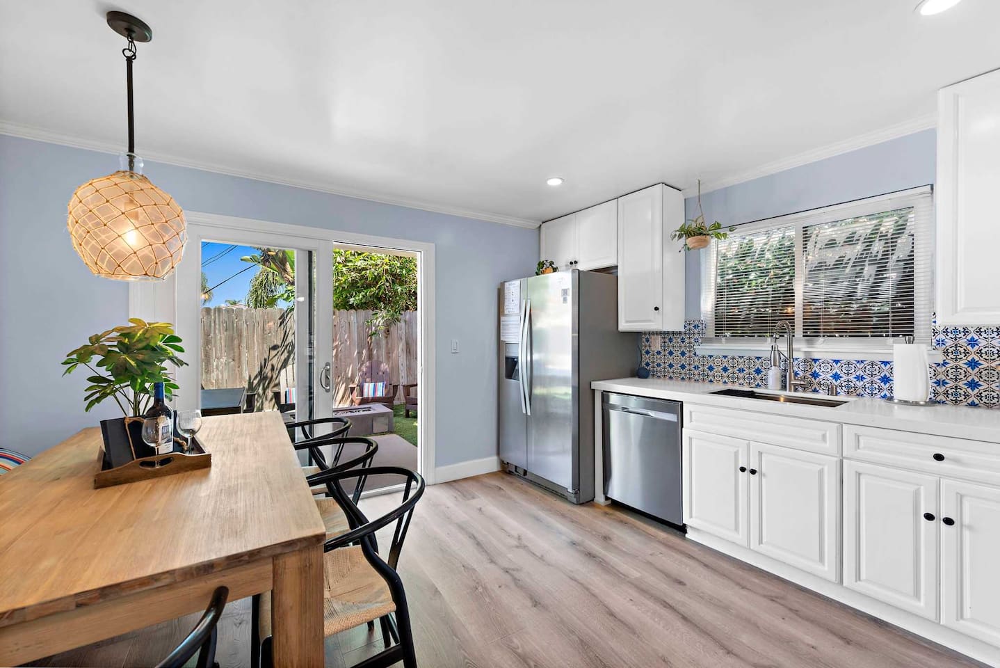 Table seats 6 comfortably and the back yard is just off the kitchen if you prefer to eat outside.