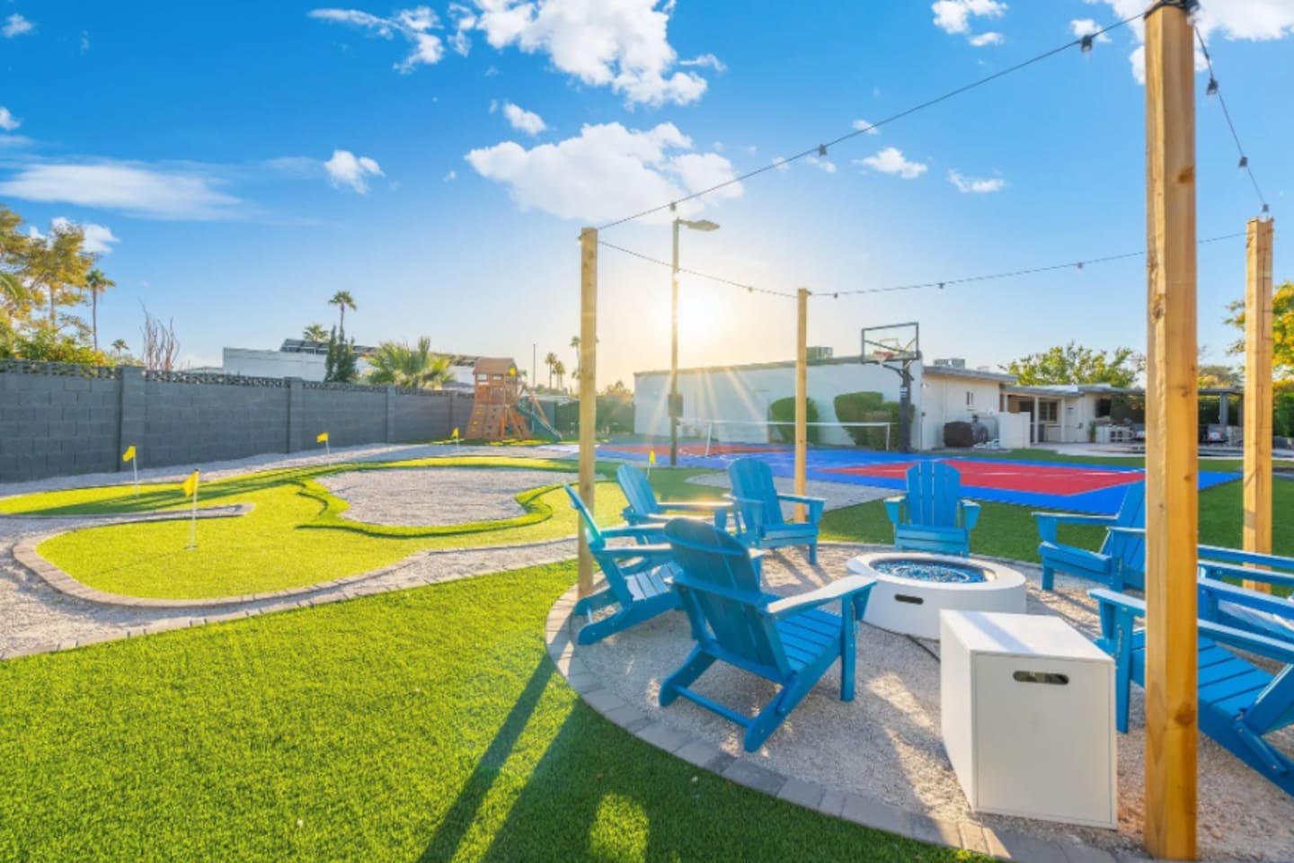 Golden hour hits just right here, with the fire pit and putting green sharing the same corner of the yard.
