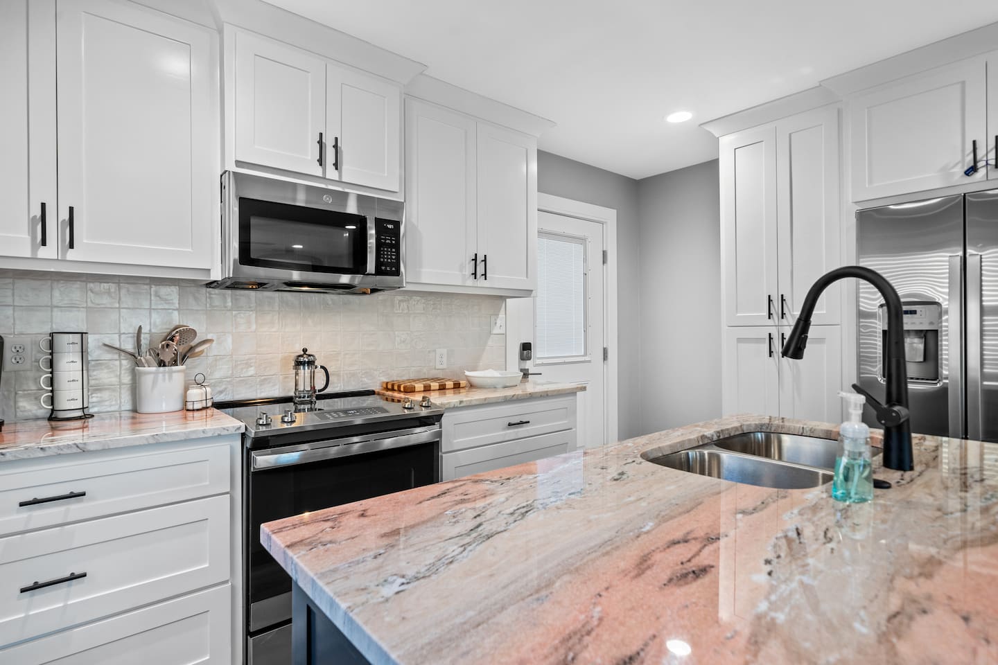 Enjoy Full Size Appliances and Flamingo Pink Granite Countertops!  Everything is Brand New! 