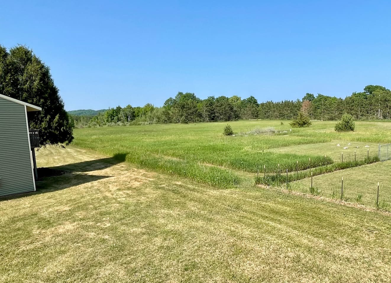 Breathe in the fresh air and take in stunning views of rolling meadows and forested tree lines. This peaceful, private setting offers the perfect escape—ideal for morning walks, birdwatching, or simply enjoying the serenity of nature.