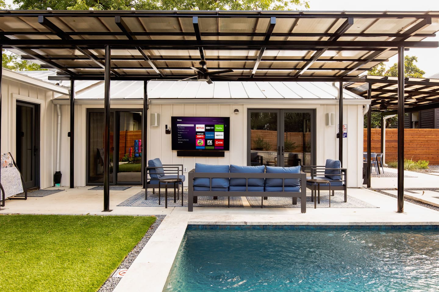Private poolside lounge with Roku TV & sound system - your own outdoor living room.