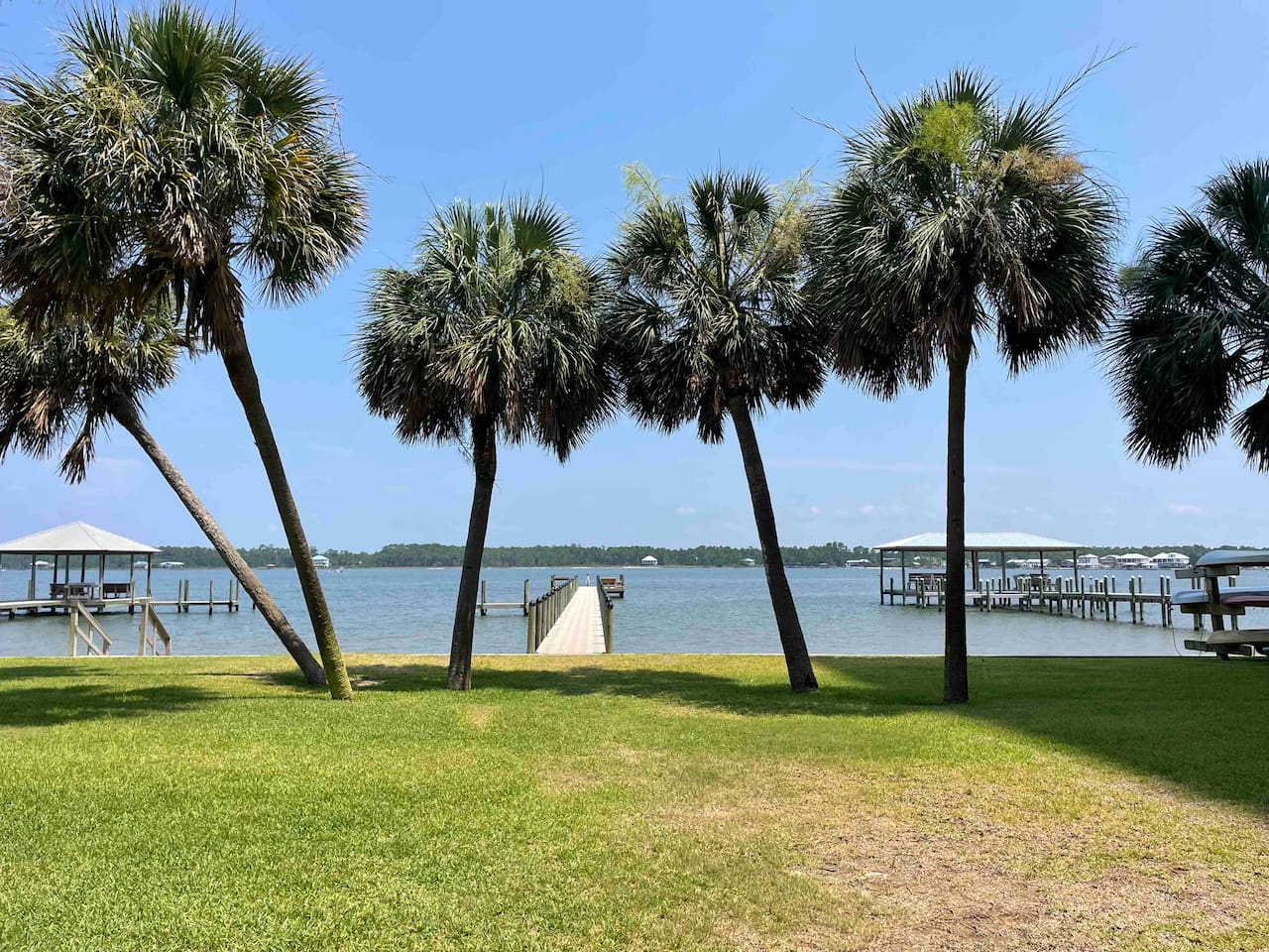 A beautiful lagoon just steps away from the condo, offering serene waters, palm trees, and peaceful docks.