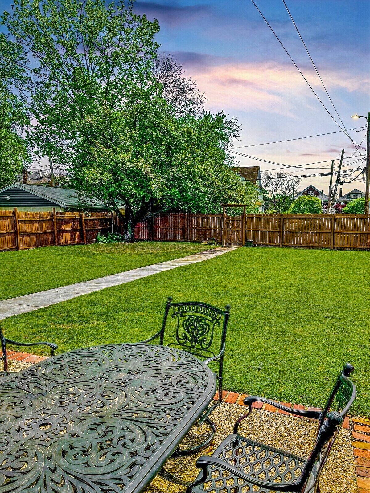 The private fully fenced back yard is the perfect place to enjoy Louisville's Four Seasons. 