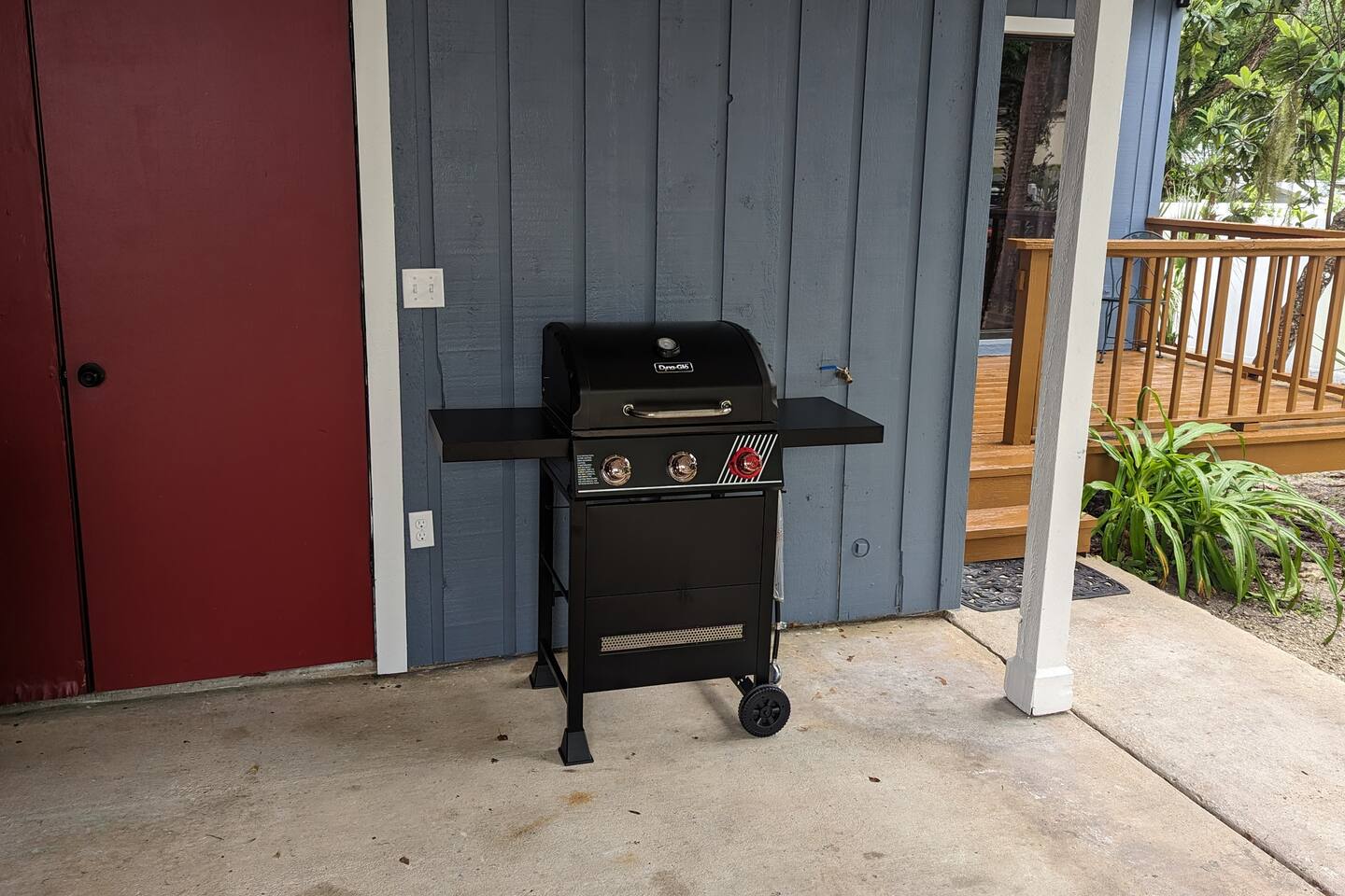 Gas grill and front porch leading into living room