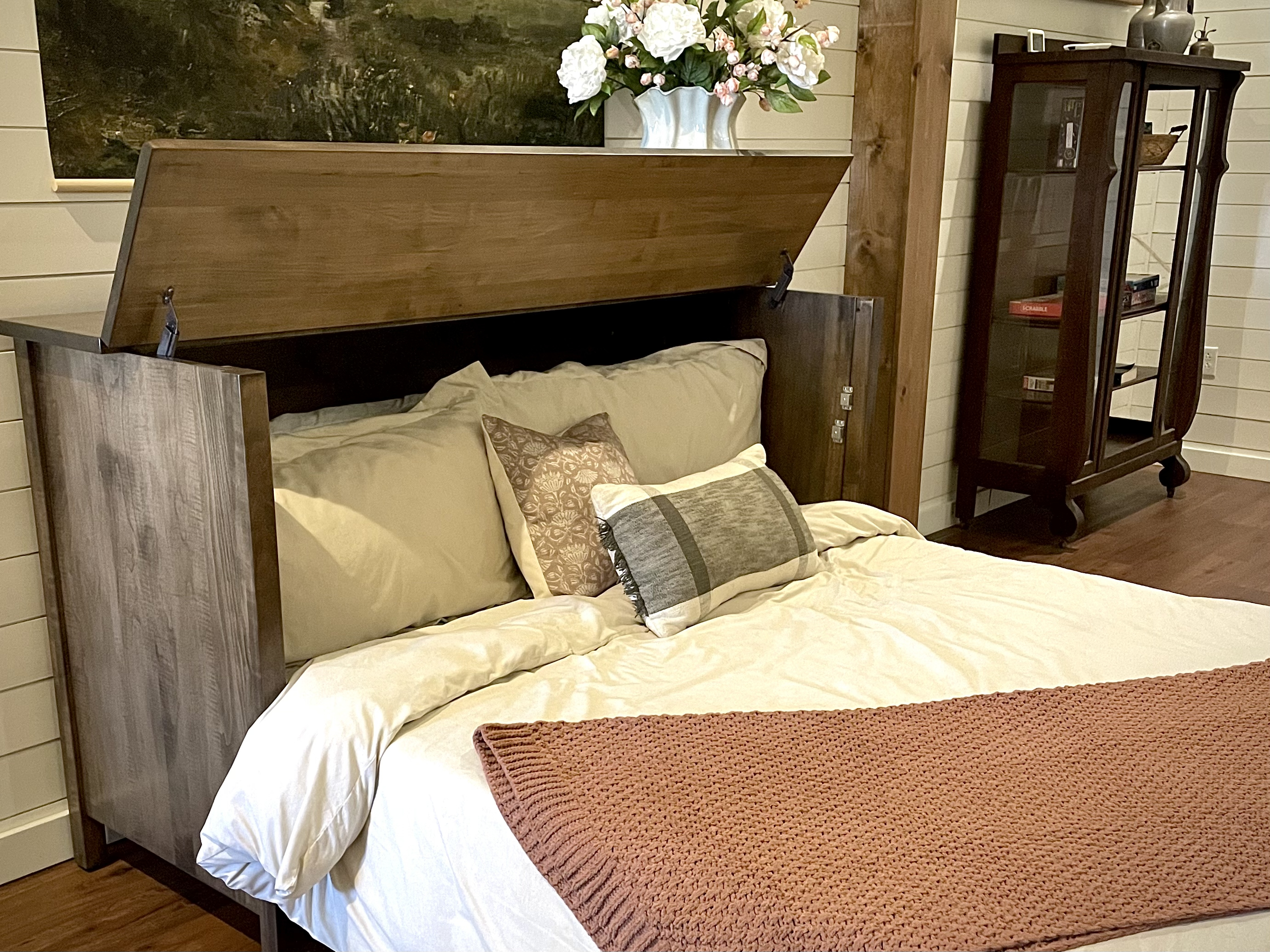 Custom console bed opens into a comfortable sleeping space for additional guests