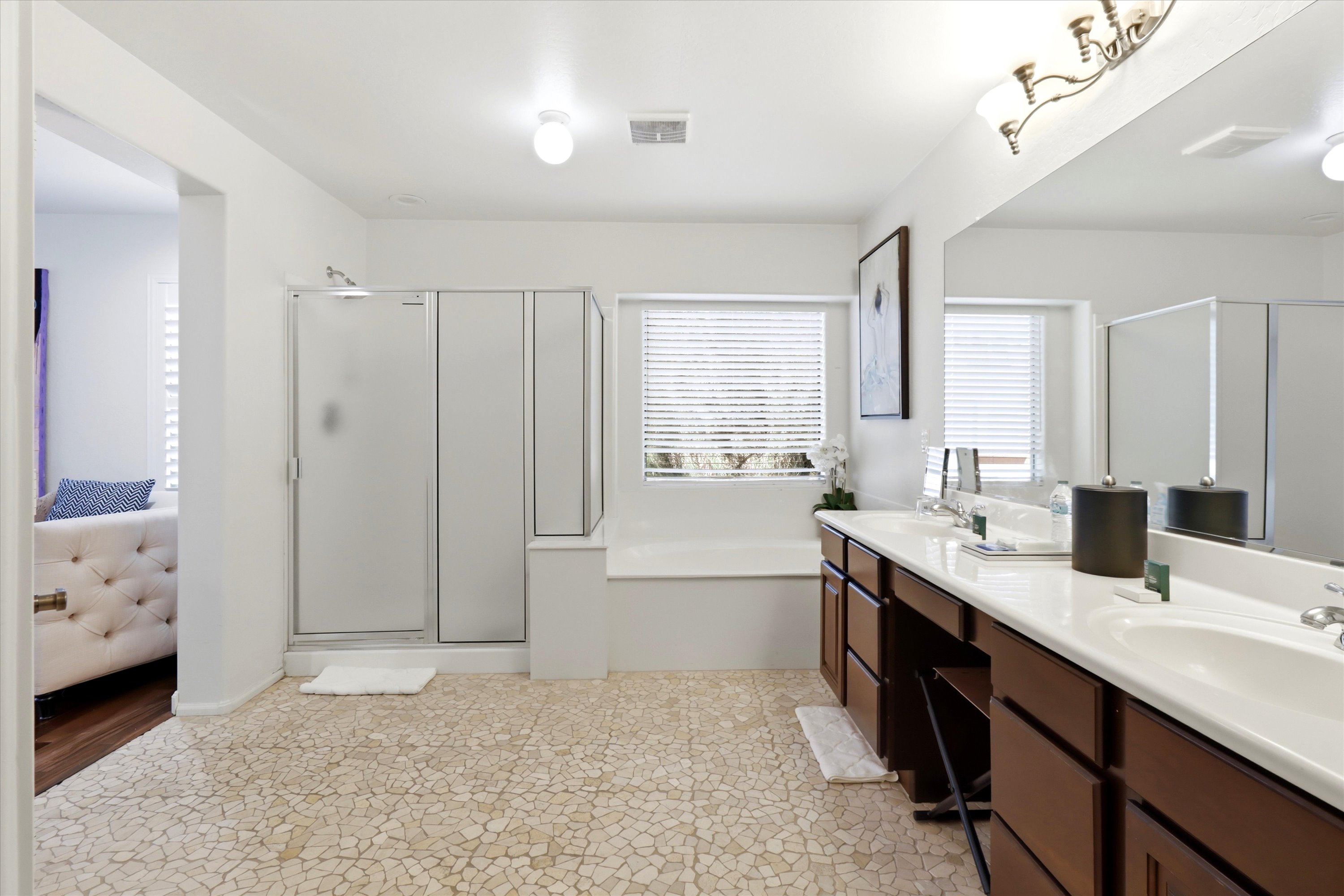 Bathroom with double sinks, a soaking tub, separate shower, and plenty of room to get ready.
