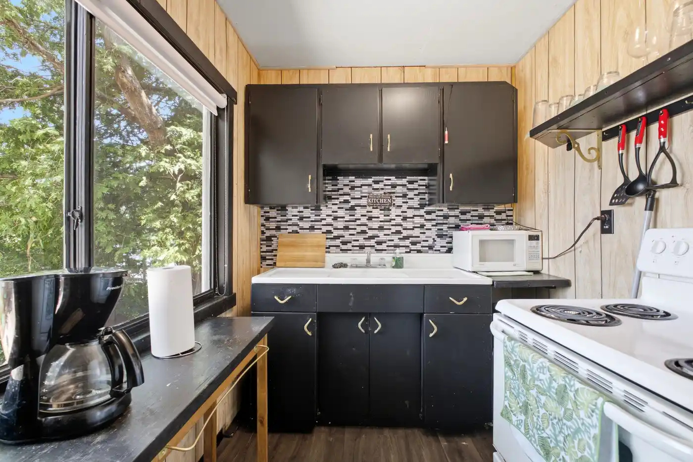Compact kitchen with modern appliances and storage