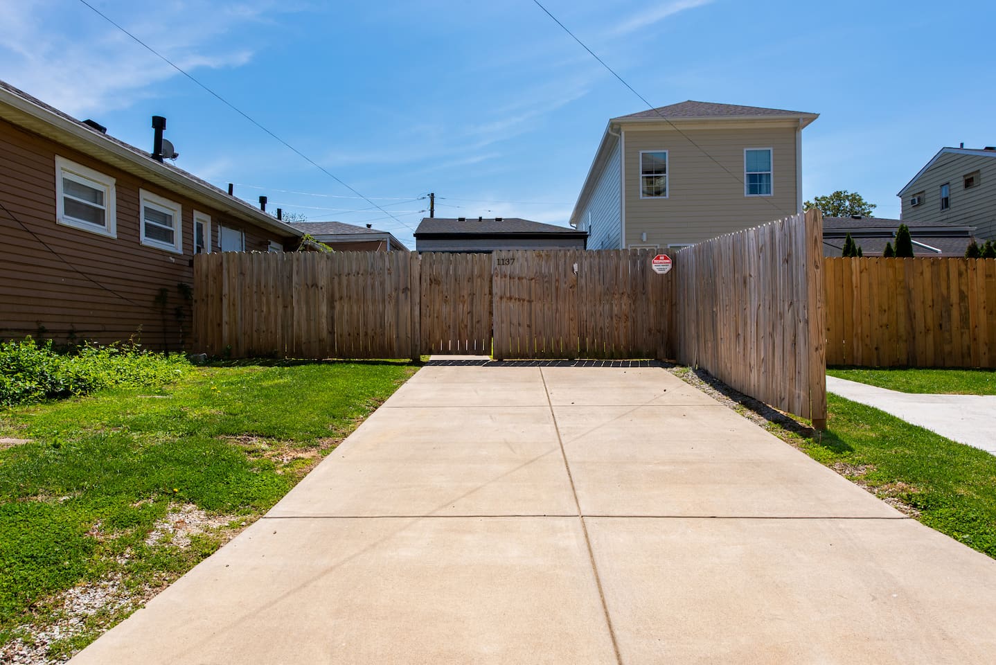 Large parking pad, enter from back alley.