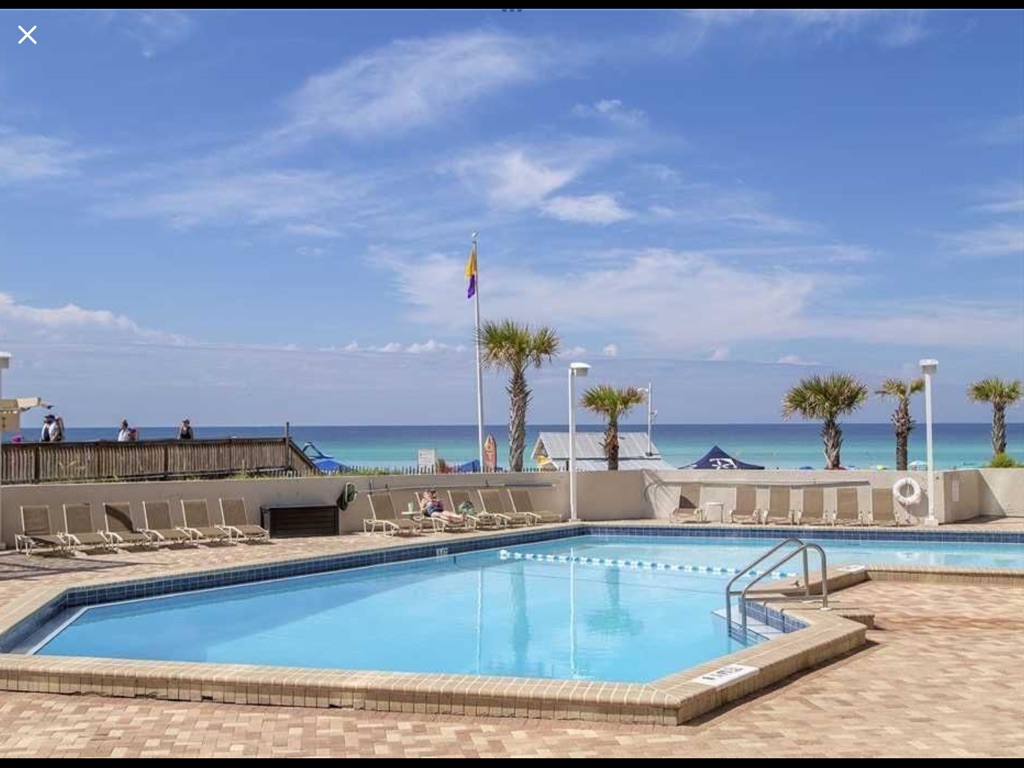 Pool by beach at condo