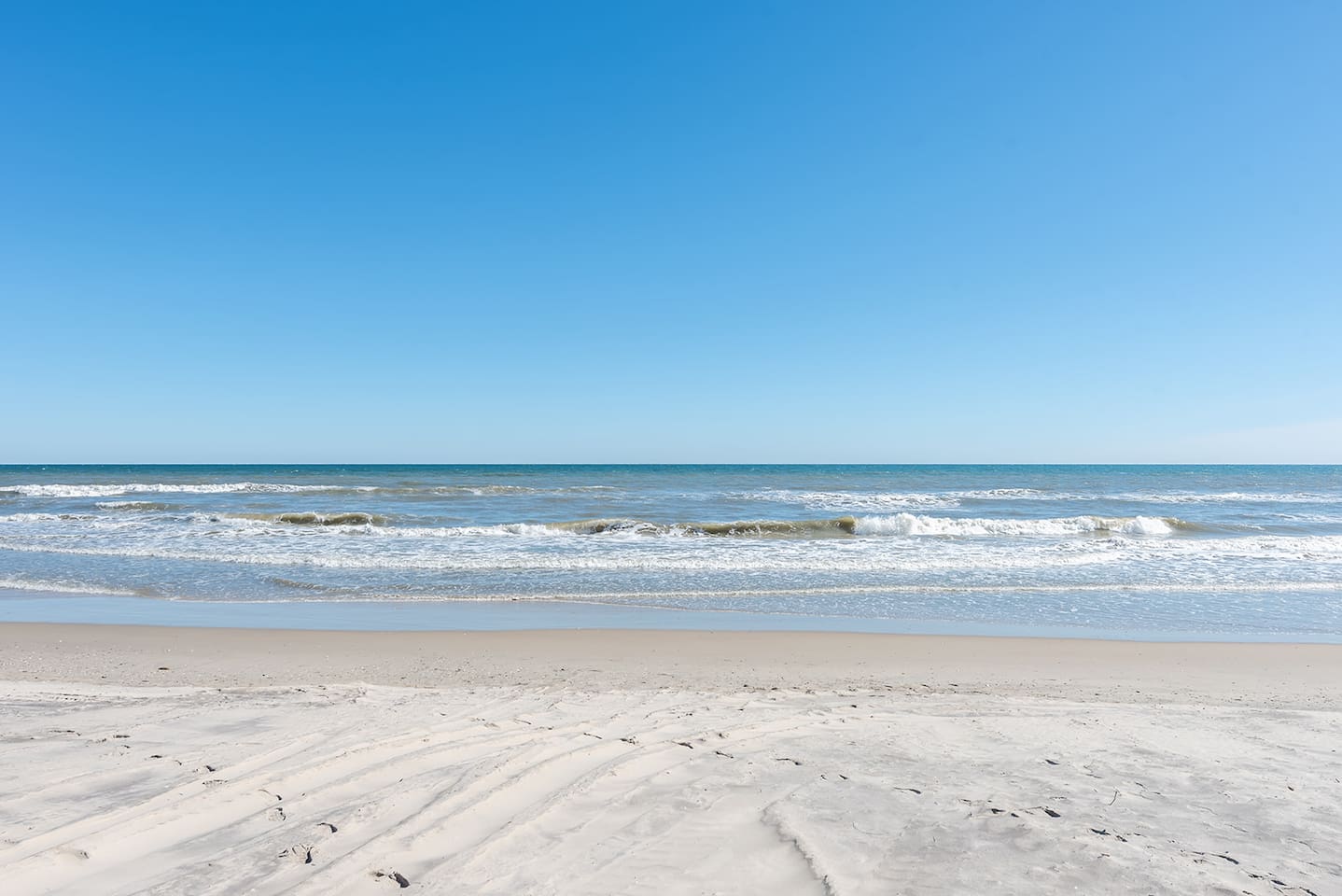 The beach is nearby, offering miles of sand and surf for a relaxing day by the water.