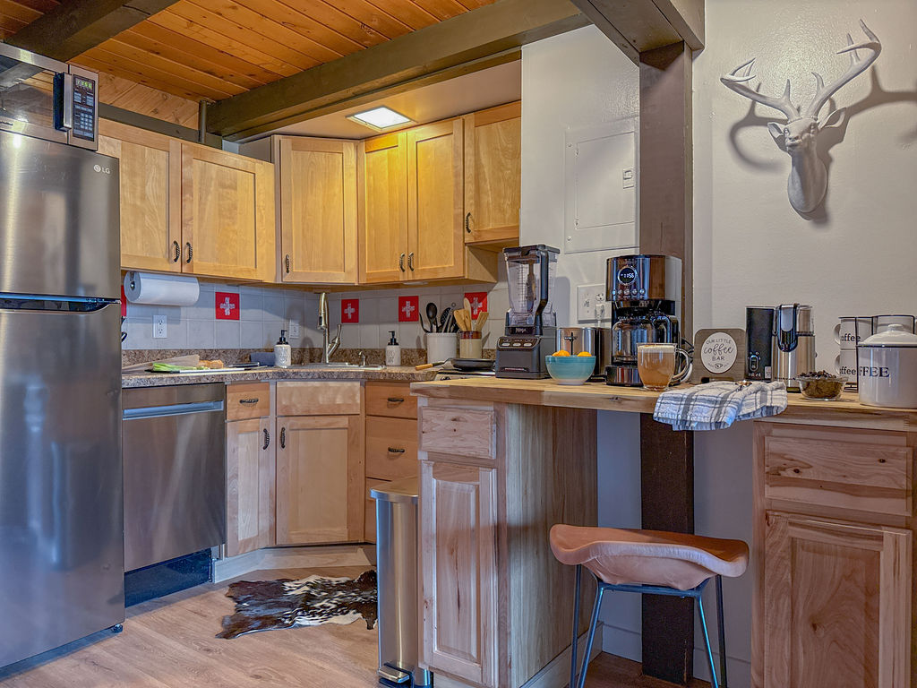 The kitchen utilizes spaces well so that all of your favorite conveniences are included...