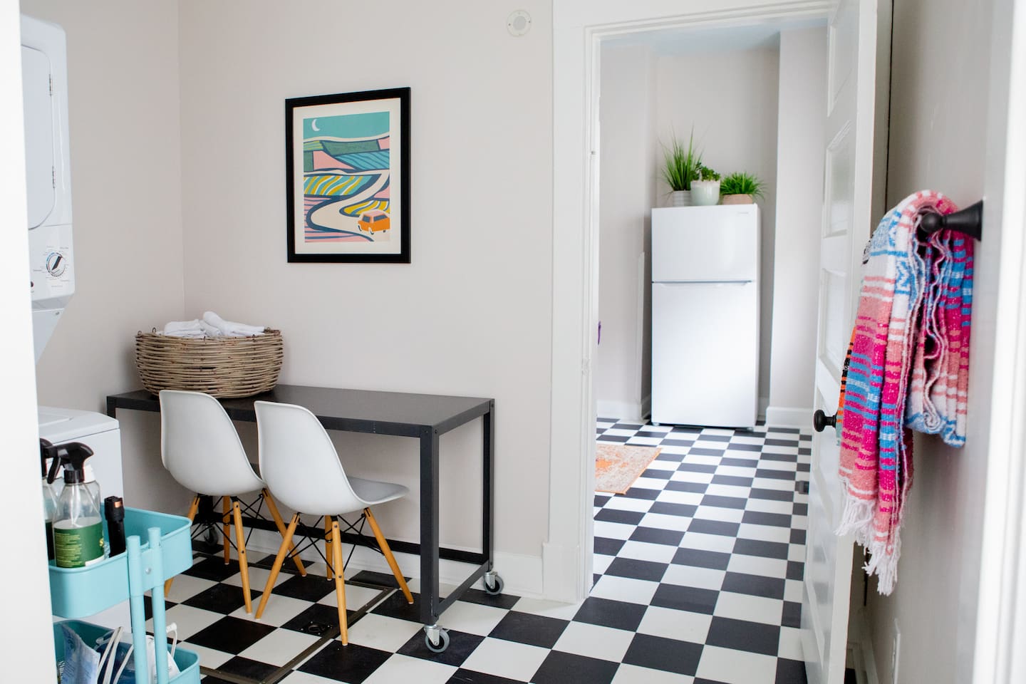 Light-filled flex space with laundry, rolling desk, and asy access to kitchen, bath and outdoors