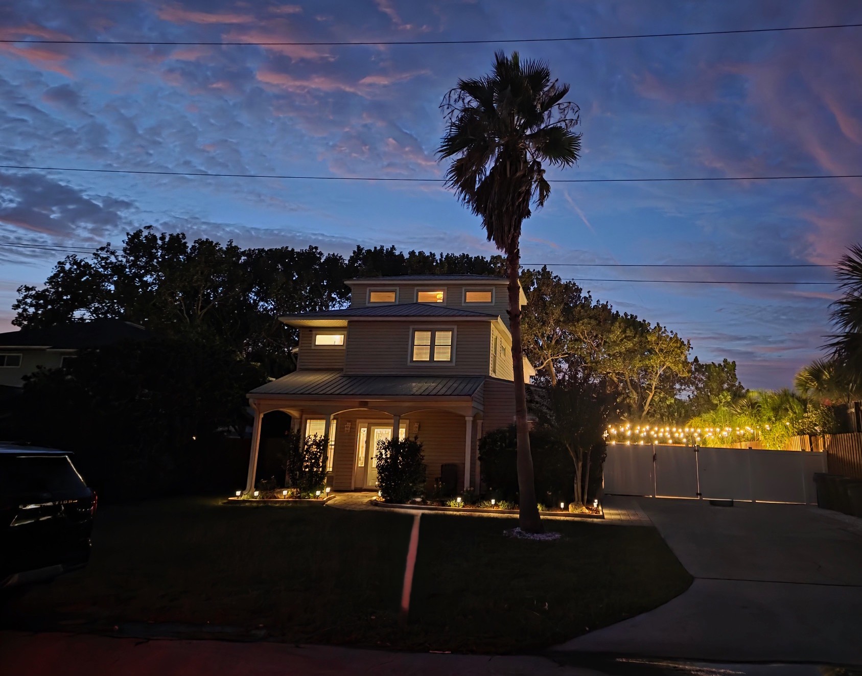 Nighttime view of the front of the house