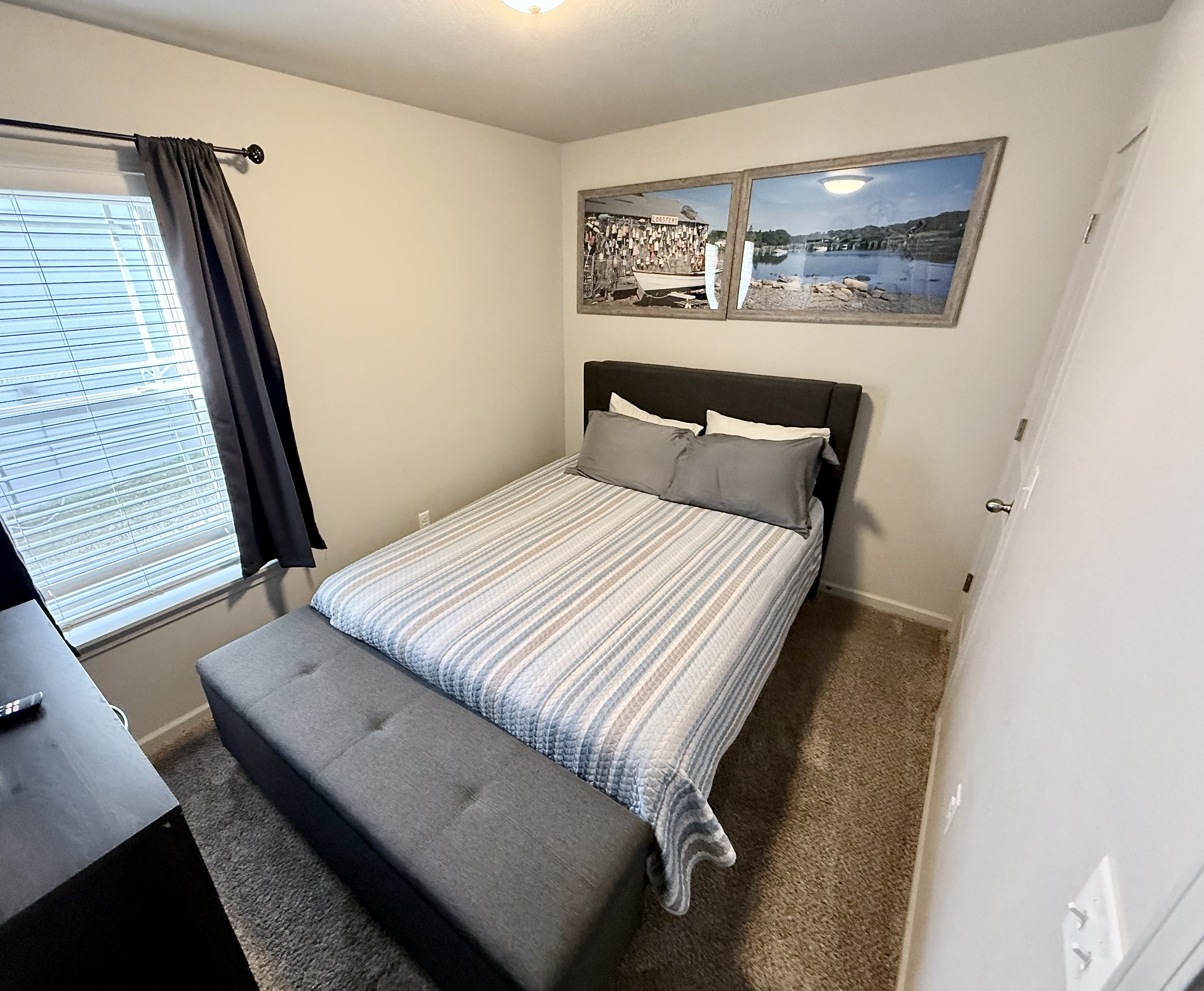 Bedroom 2 with Queen size bed and a place to sit at end of bed