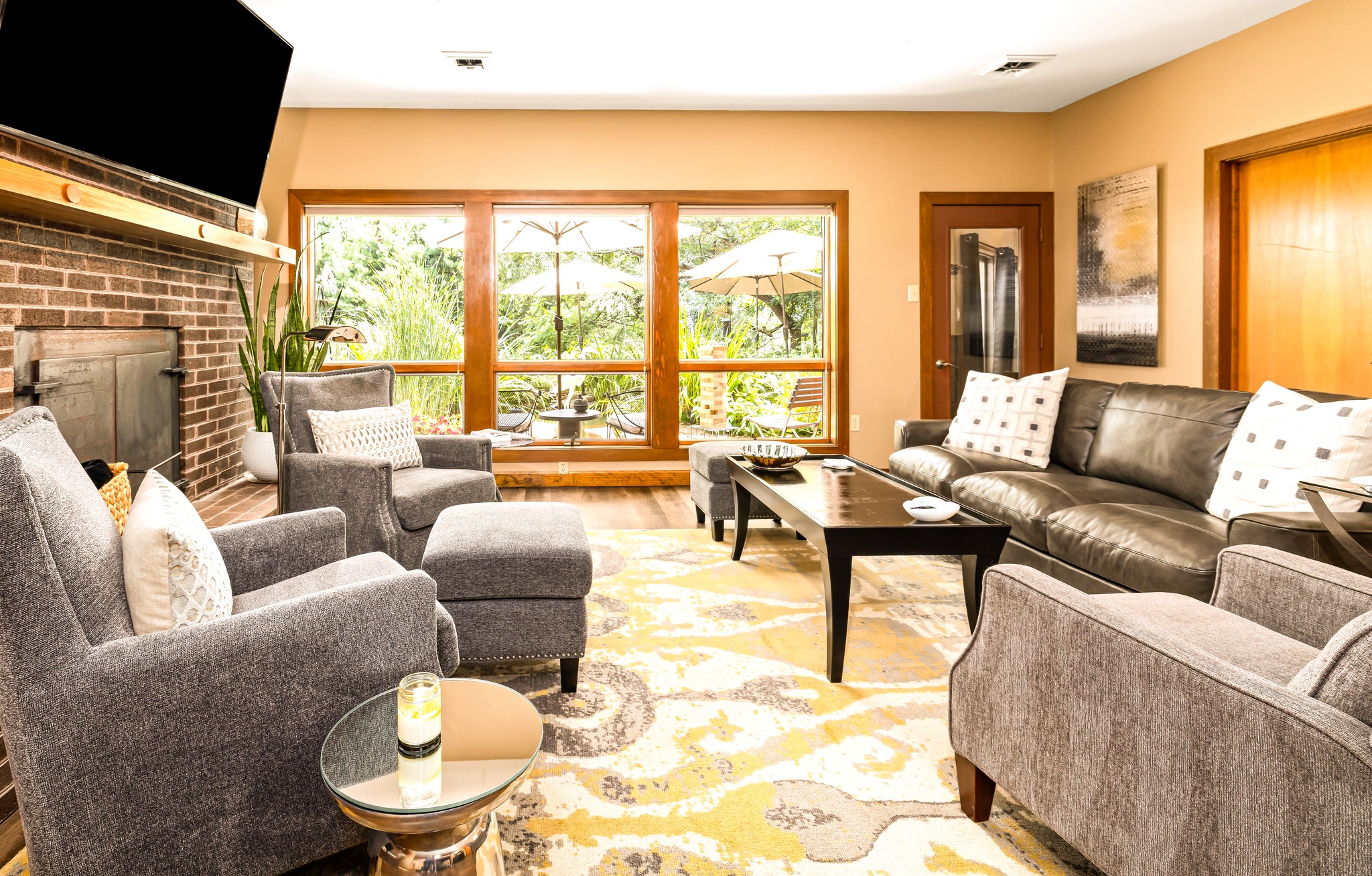 Lower level family room seating for watching games, catching up with friends, and watching the Koi!