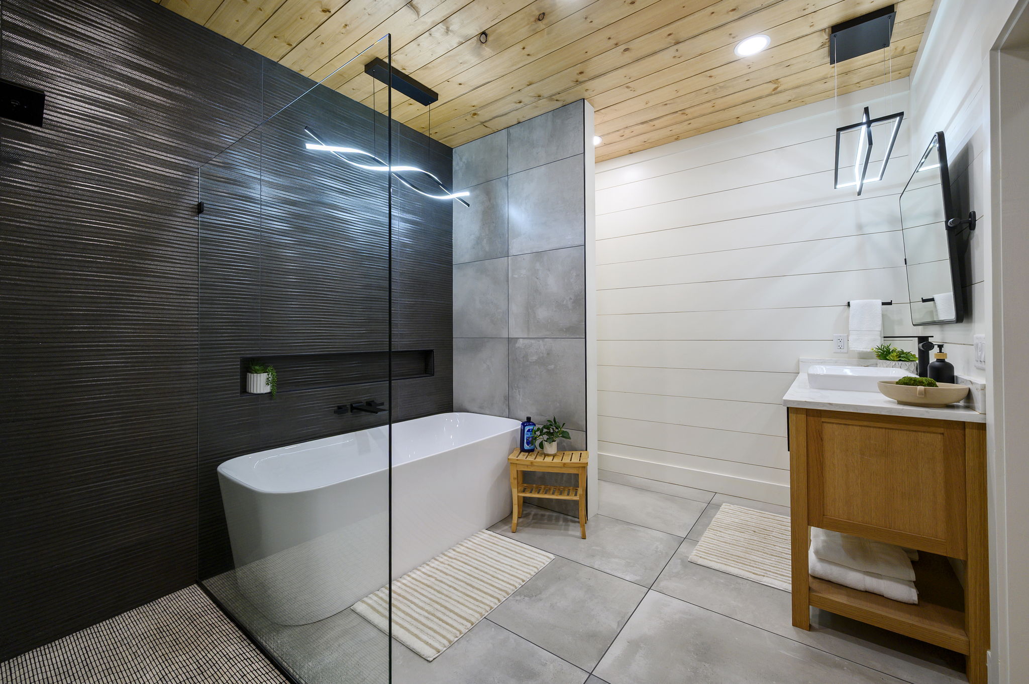 Elegant en-suite bathroom with a soaking tub, walk-in rain shower, and luxury finishes