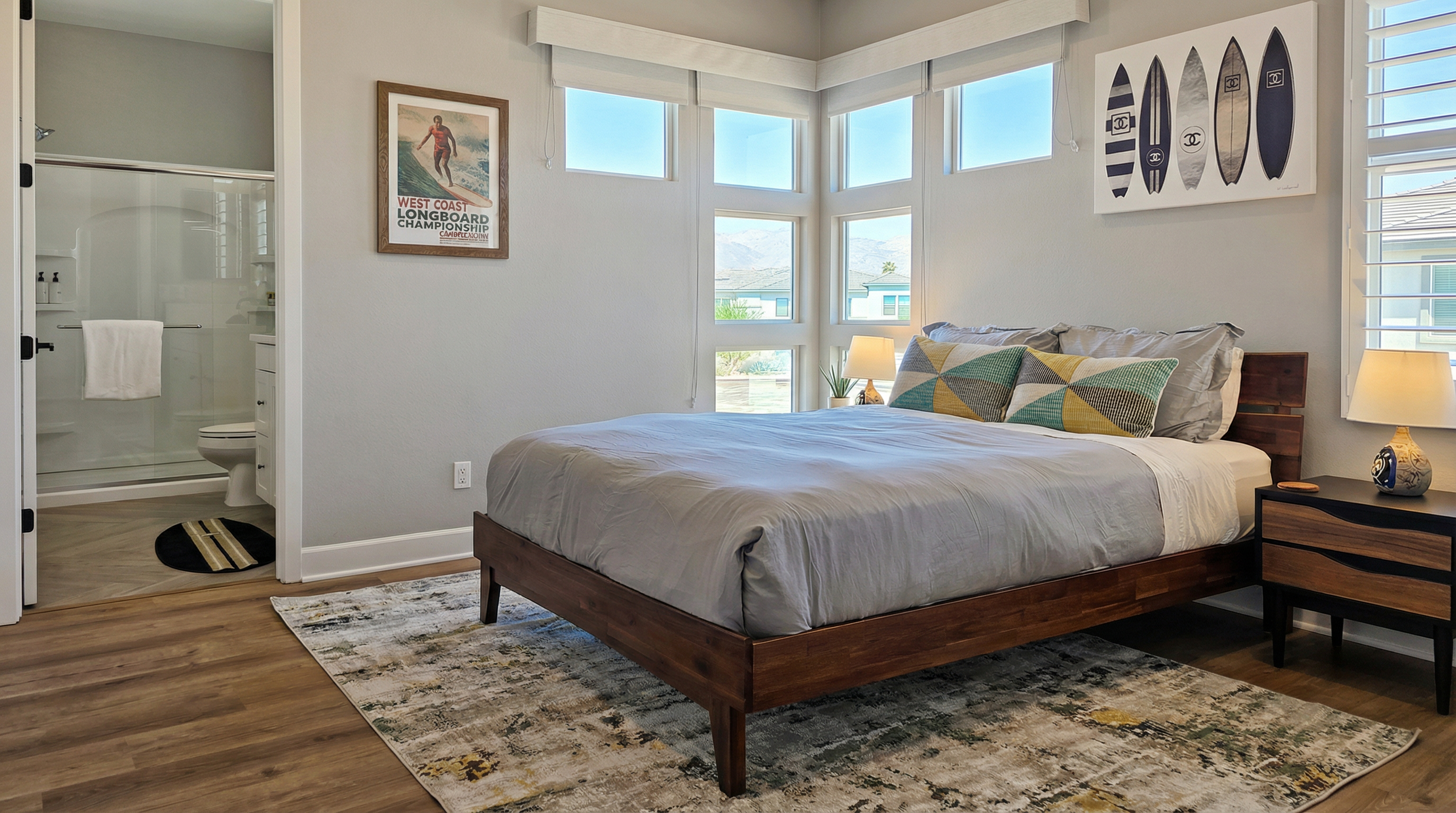 Bedroom #3 showcases tranquil lake views and an ensuite bathroom with a walk-in shower.