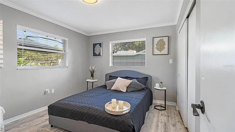 The guest room features a comfortable Queen bed.