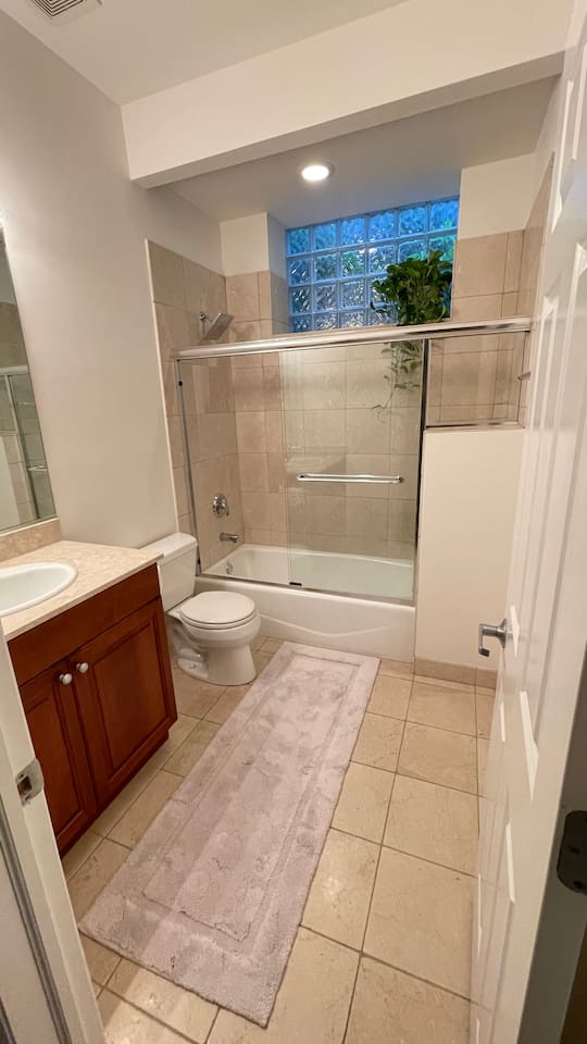 Bathroom with fresh towels and guest essentials provided