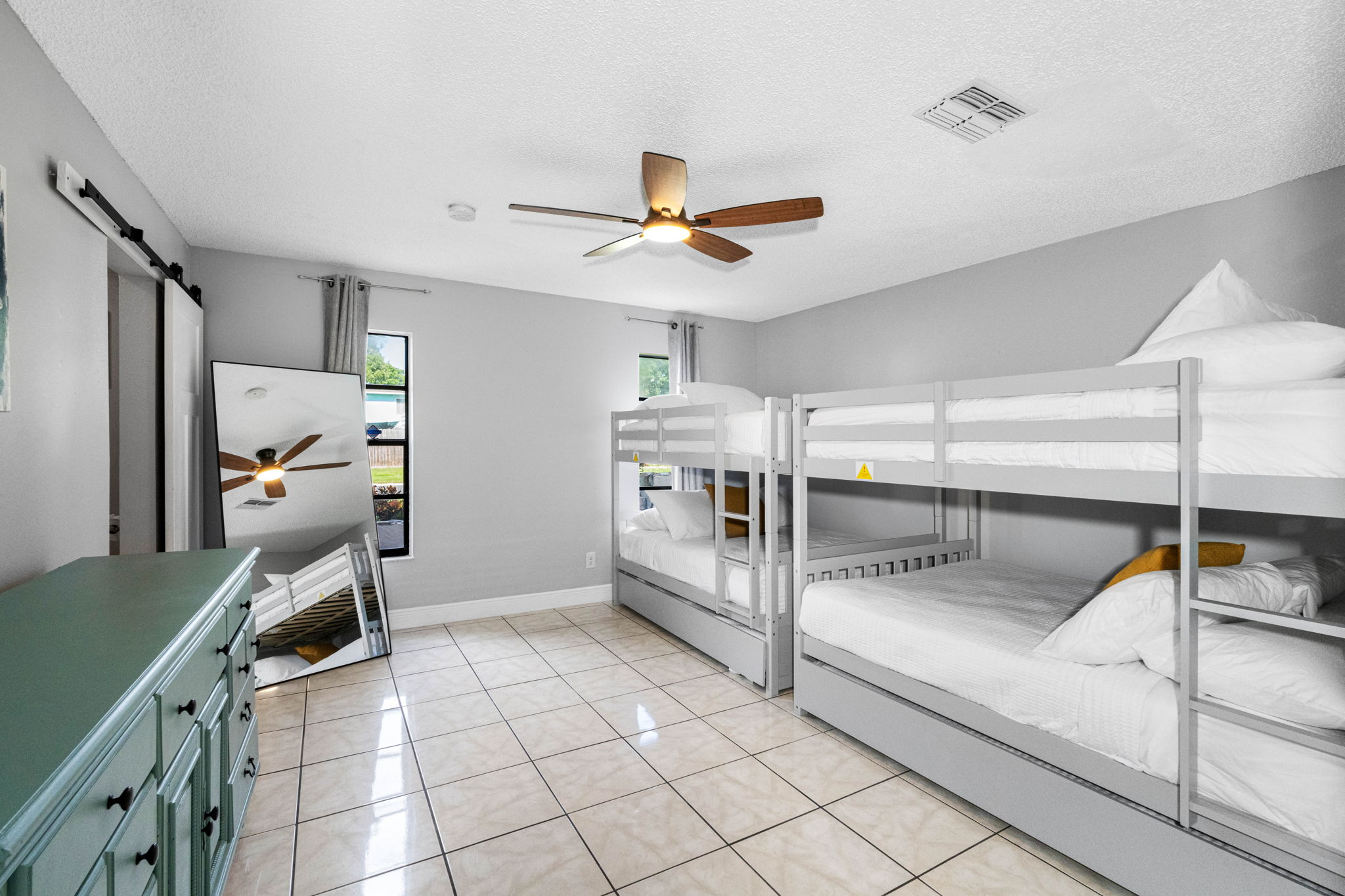 Whether you’re traveling with kids, cousins, or a crew of friends, this generously sized bunk room offers the perfect blend of comfort, space, and playful charm.