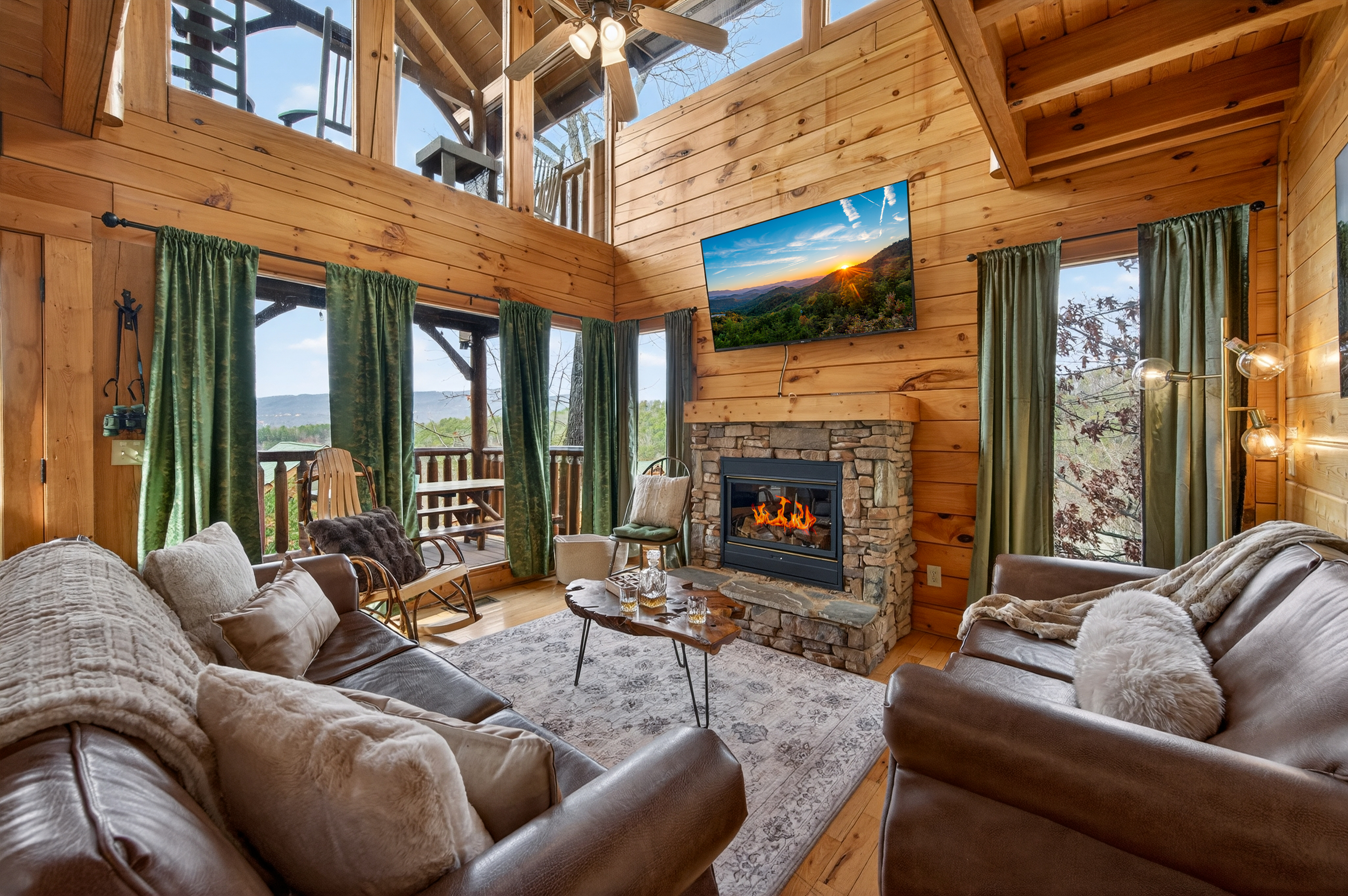 Soaring ceilings, stone fireplace, and Smoky Mountain views from every window — the heart of The Overlook.
