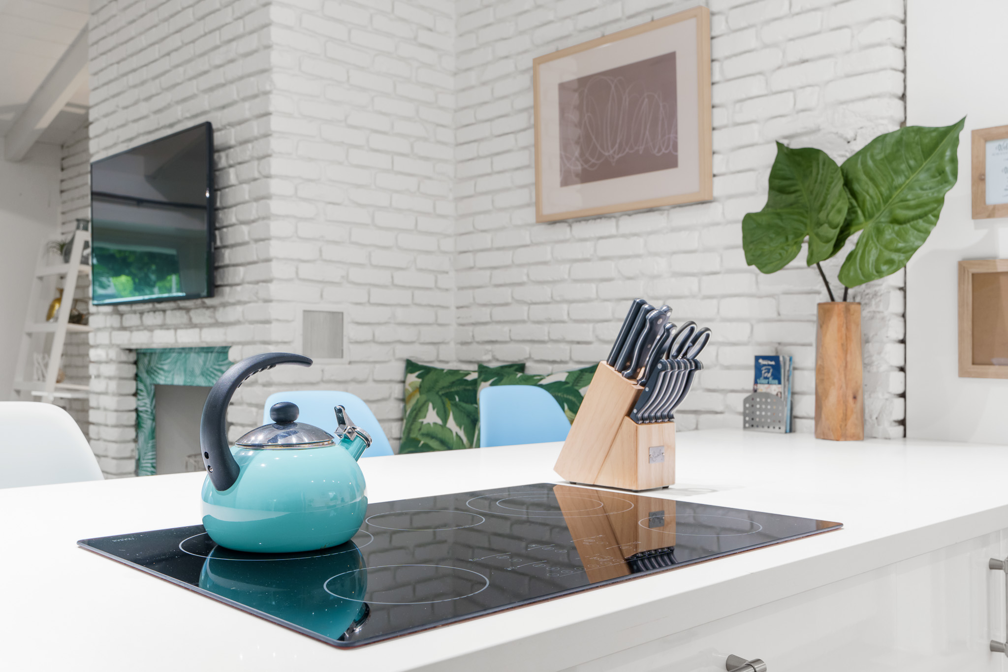 Built in stove top, generous counter-top space. pots -n-pans, baking pans, cooking utensils, serving trays, drink pitchers, and indoor/outdoor plates, cups, and kids dishes