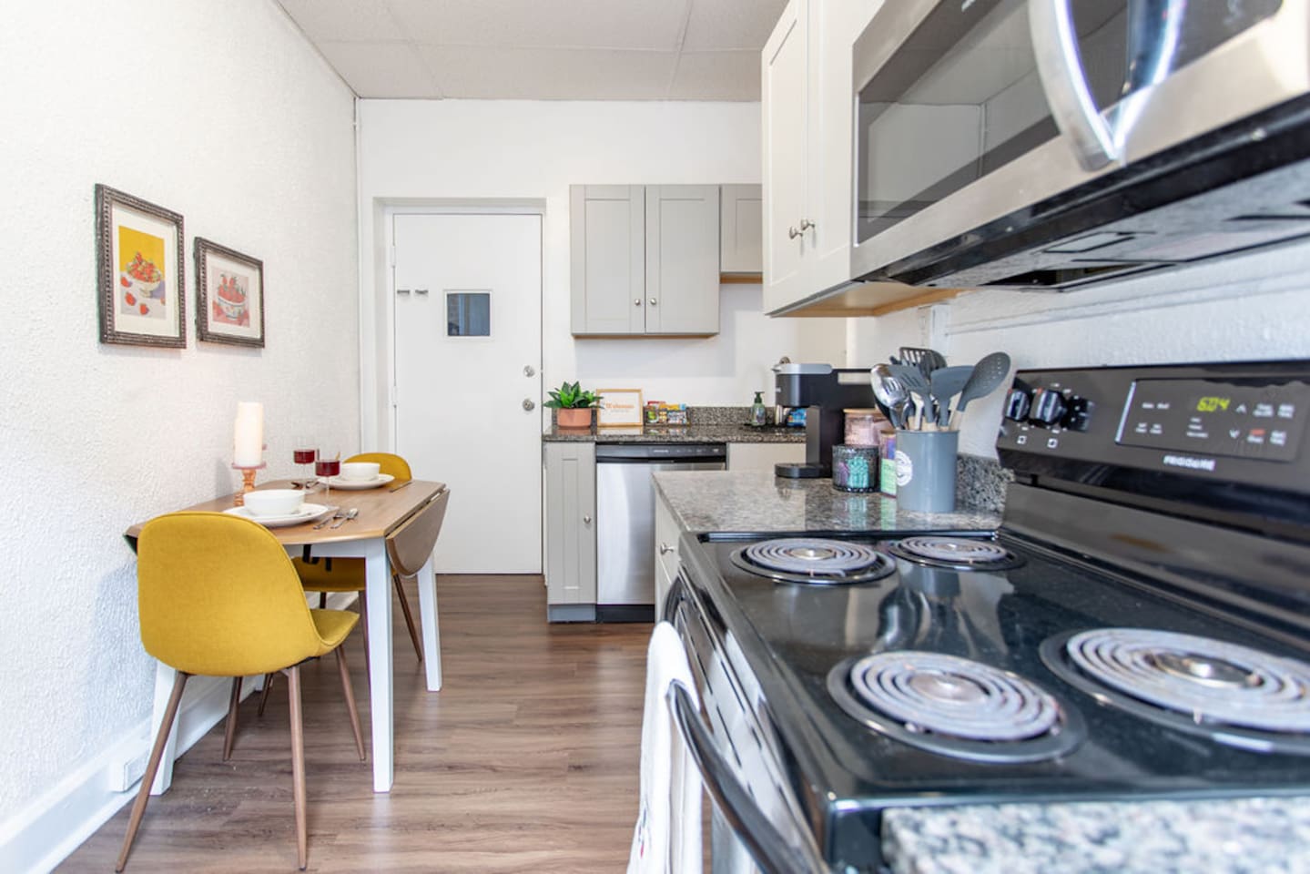 Full kitchen featuring sleek, modern stainless steel appliances for a stylish and functional cooking space.
