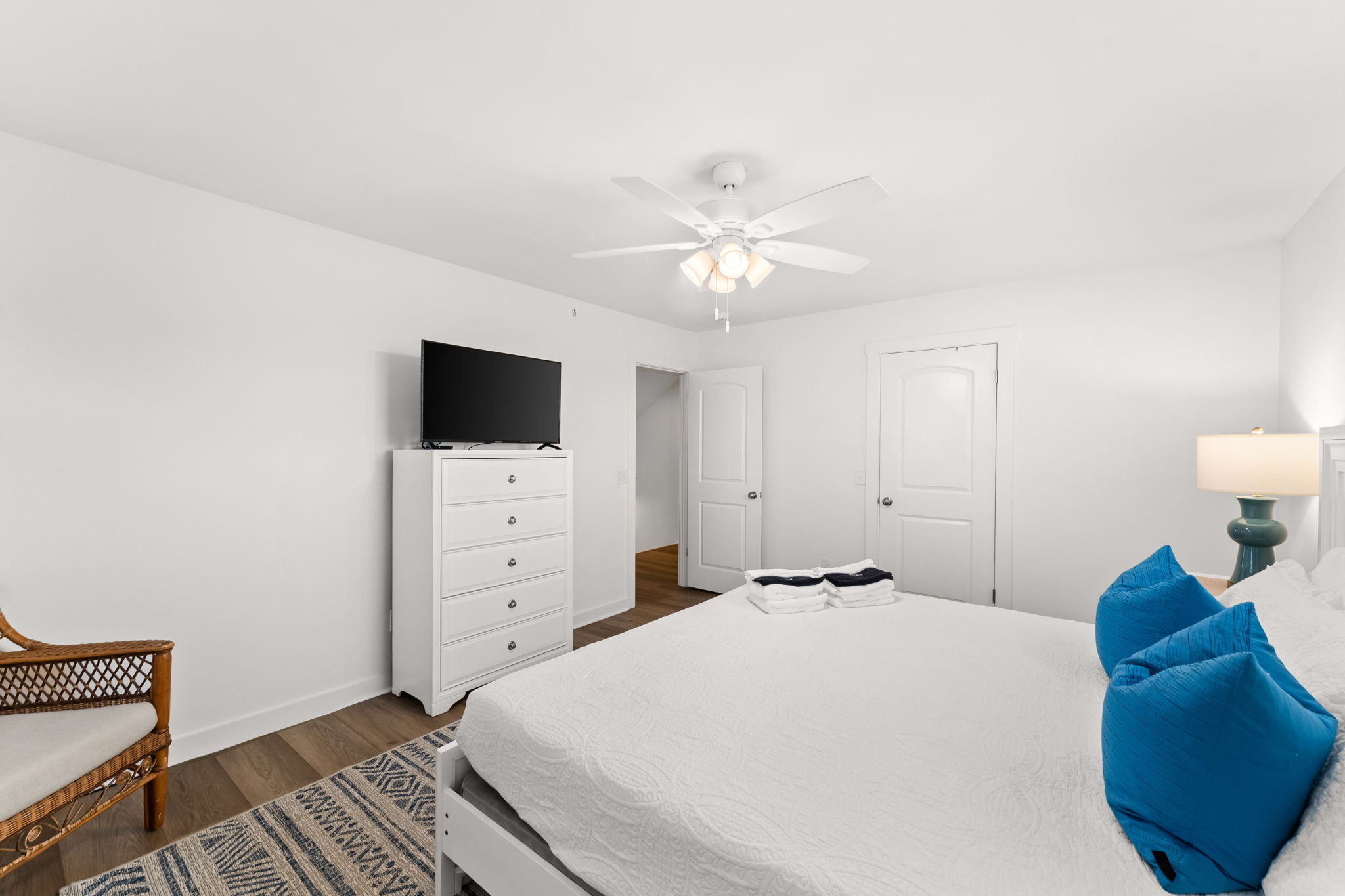 Side A, 3rd Floor: A peaceful guest suite with a plush King bed and smart TV.