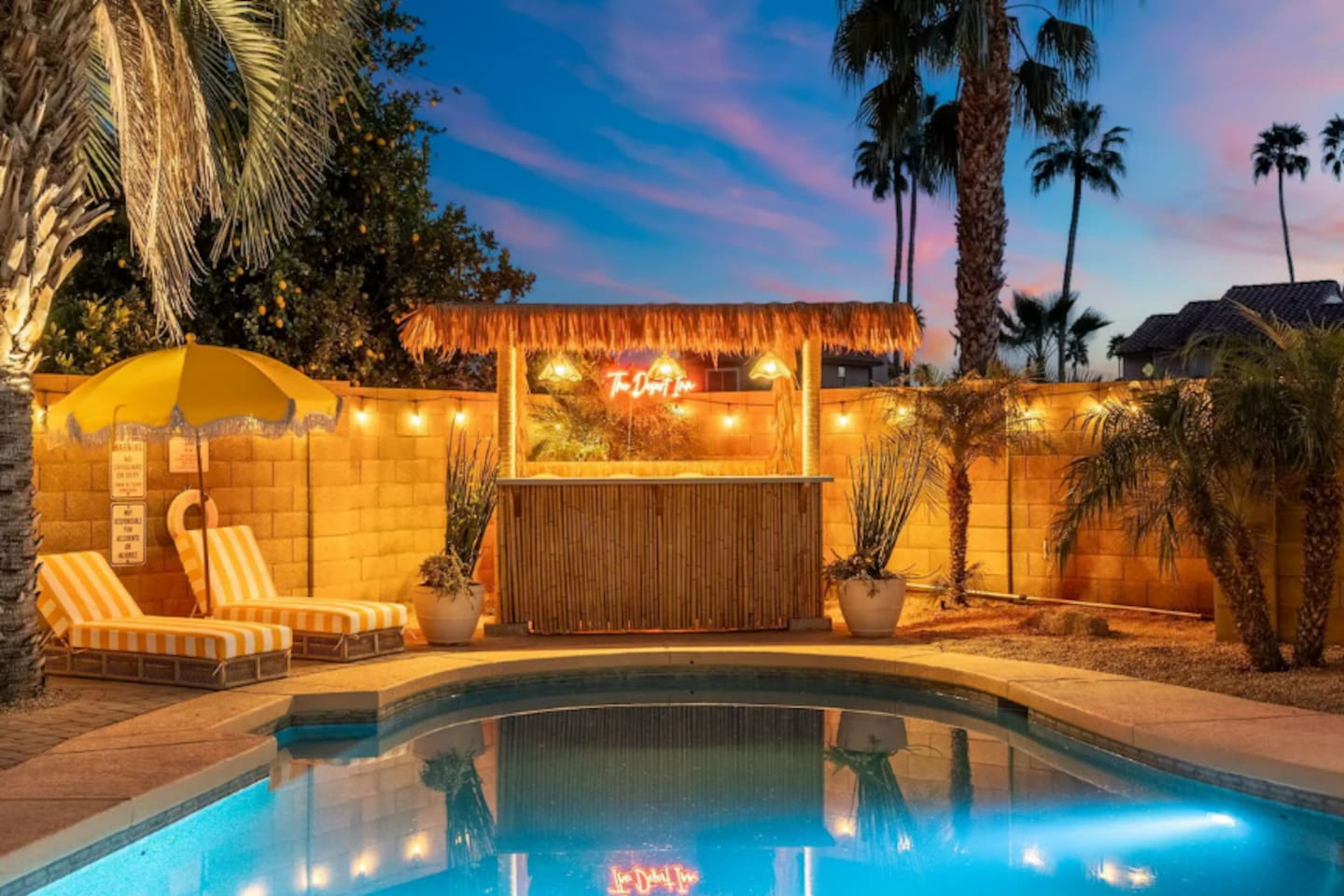 Twilight view of pool and cabana.
