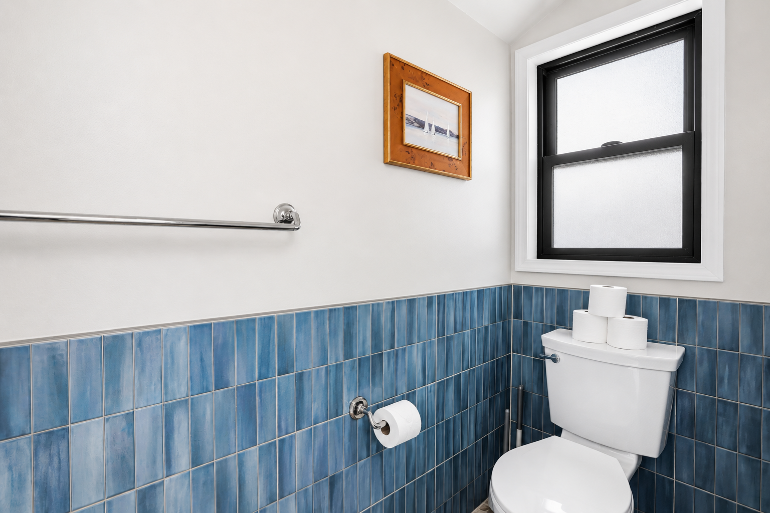 Enjoy the convenience of this modern bathroom located in the indoor pool area, complete with blue tile accents, contemporary finishes, and easy access for guests enjoying the pool.