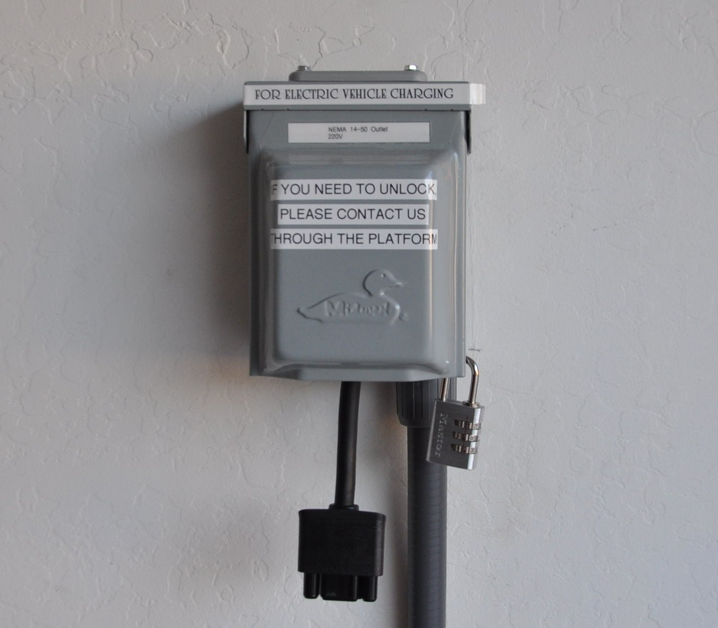 We offer a NEMA 14-50 outlet in the garage (220V) or a standard 110V outlet for you to use. Please note that we do not offer any cords at this time.