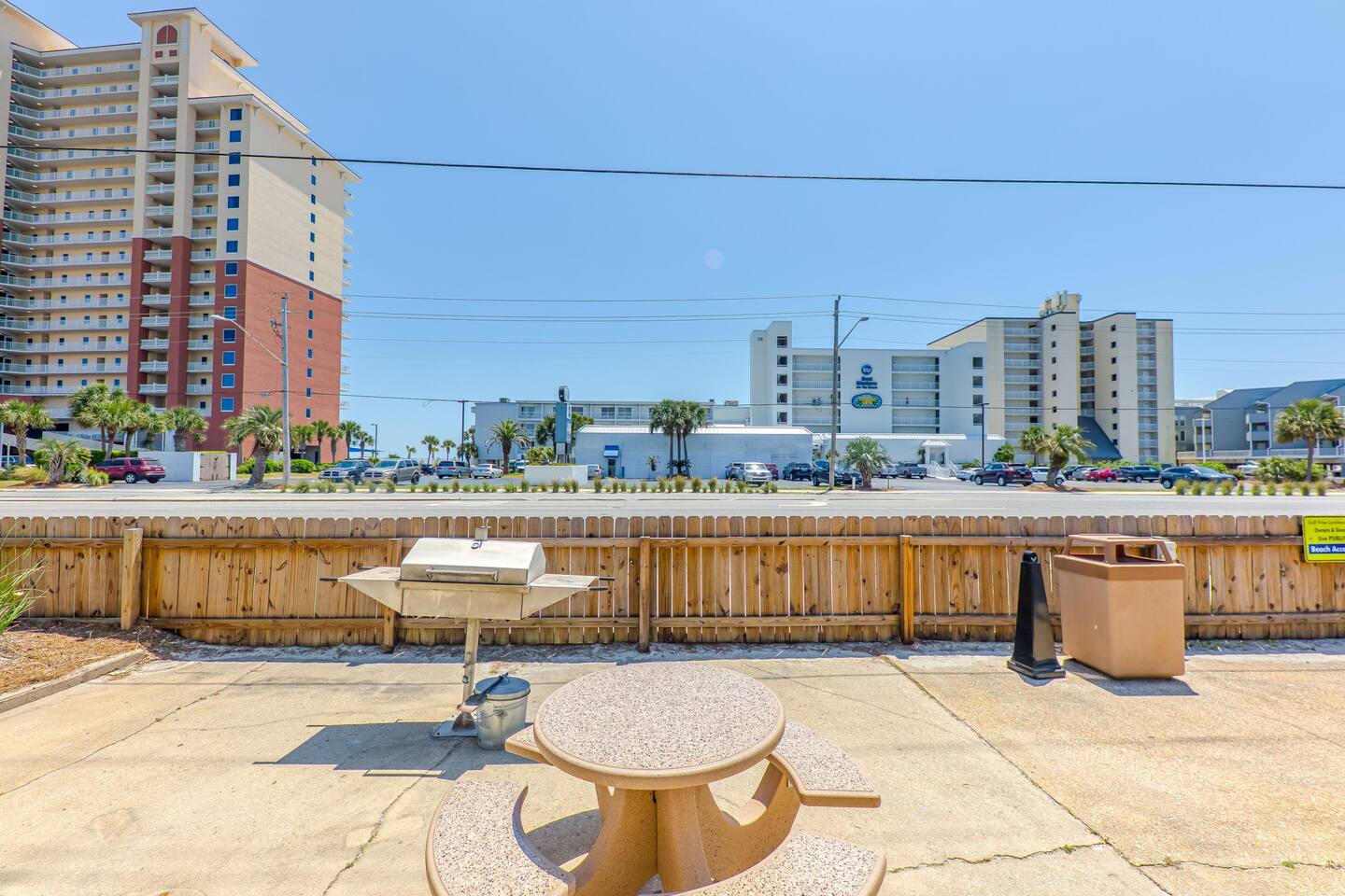 Outdoor Grill Area: Enjoy sunny cookouts and vibrant Gulf Shores vibes right outside your door!