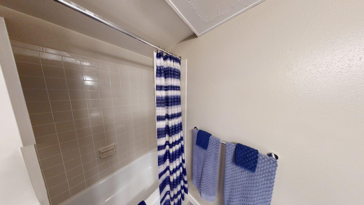 Comfortable and newly remodeled bathroom. The space is designed for relaxation with soft lighting, a luxurious shower, and inviting textures.