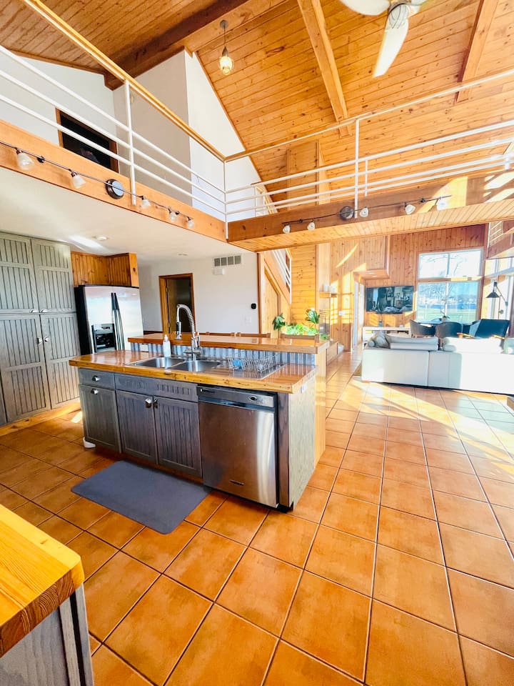 Open concept living area with vaulted ceilings and plenty of space to gather.