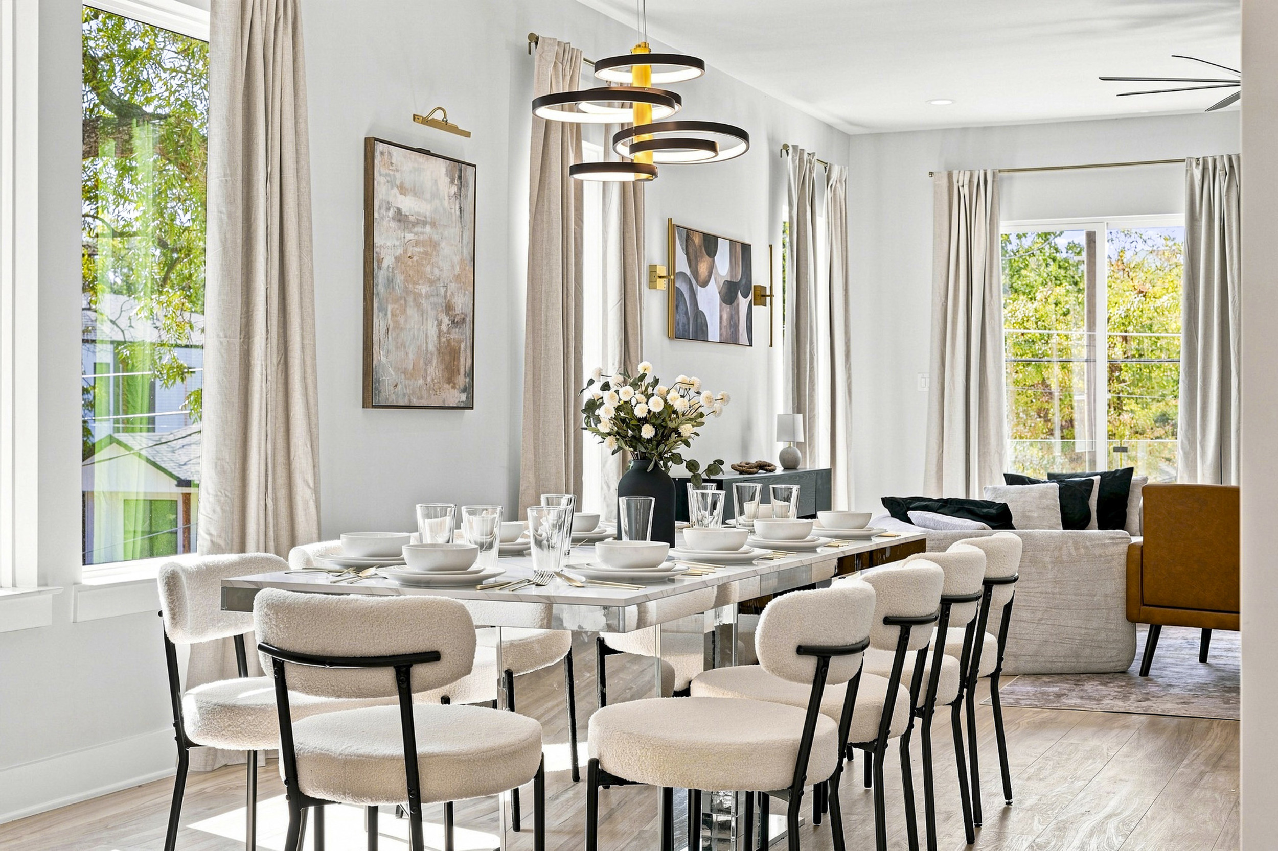 Gather around for delicious meals in this chic, sunlit dining space!