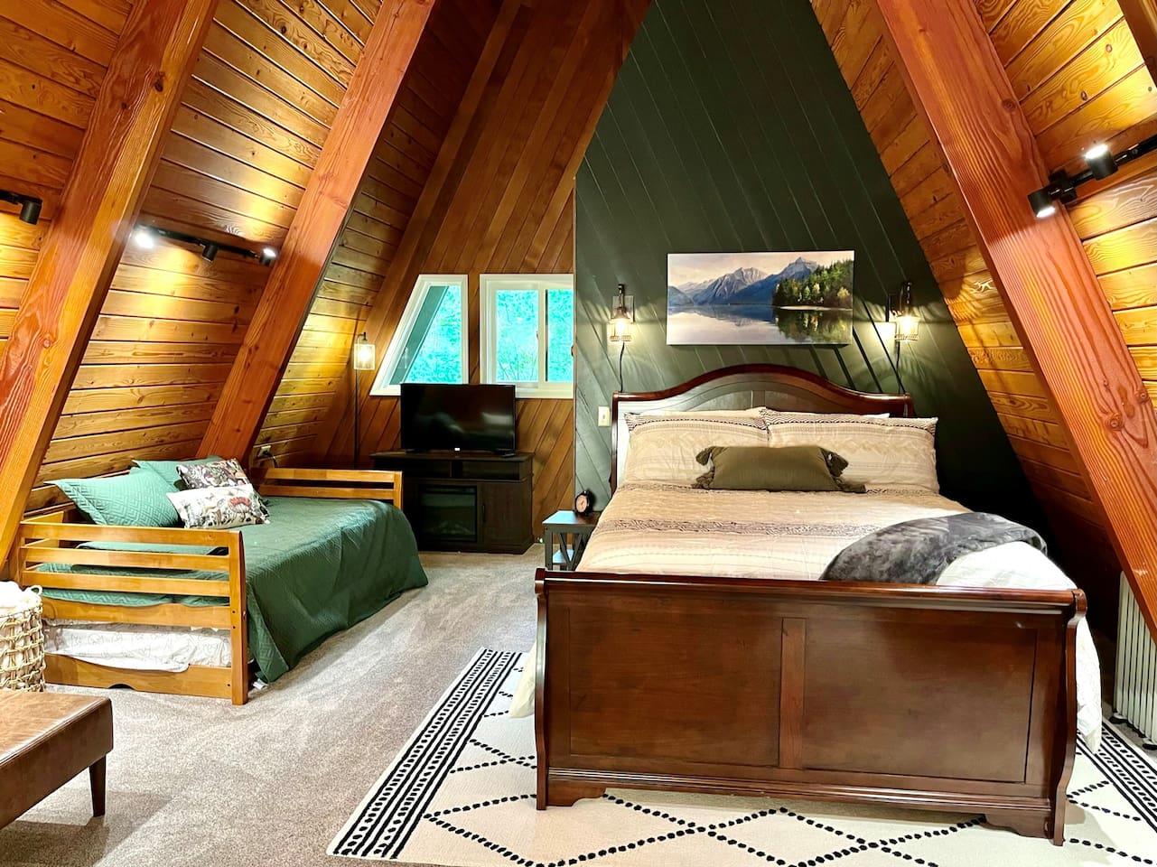 Loft bedroom with queen bed, 2 twin beds, on suite bathroom, seating area, and great view!