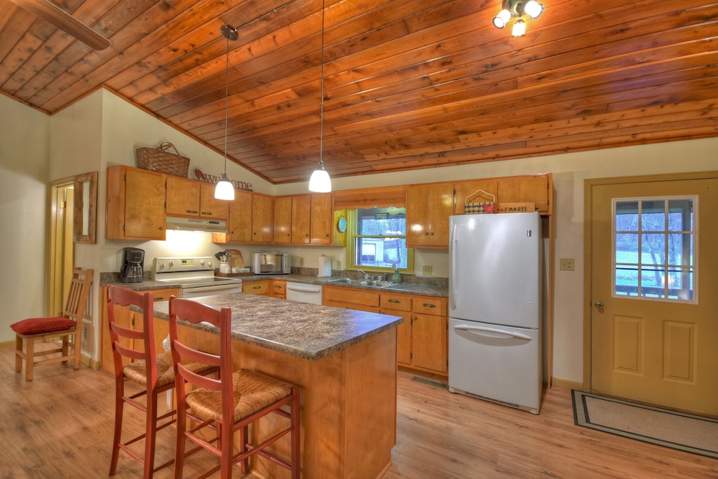 kitchen with loads of dishes, pots and pans