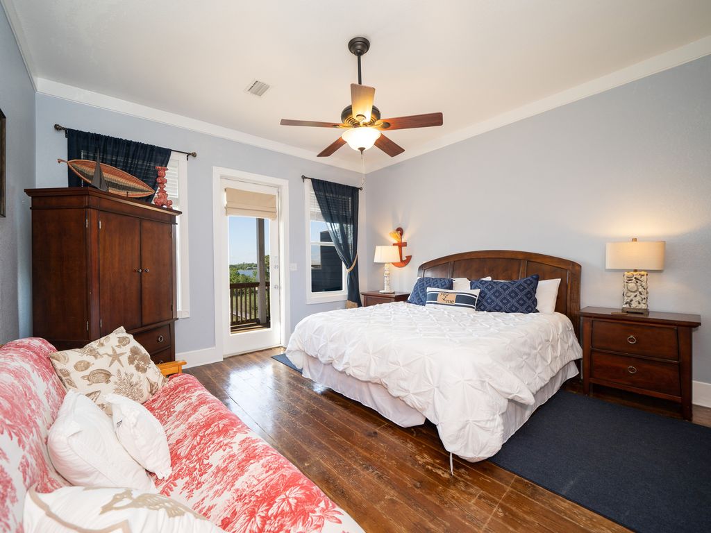 Upstairs Master Bedroom with Lagoon View & TV