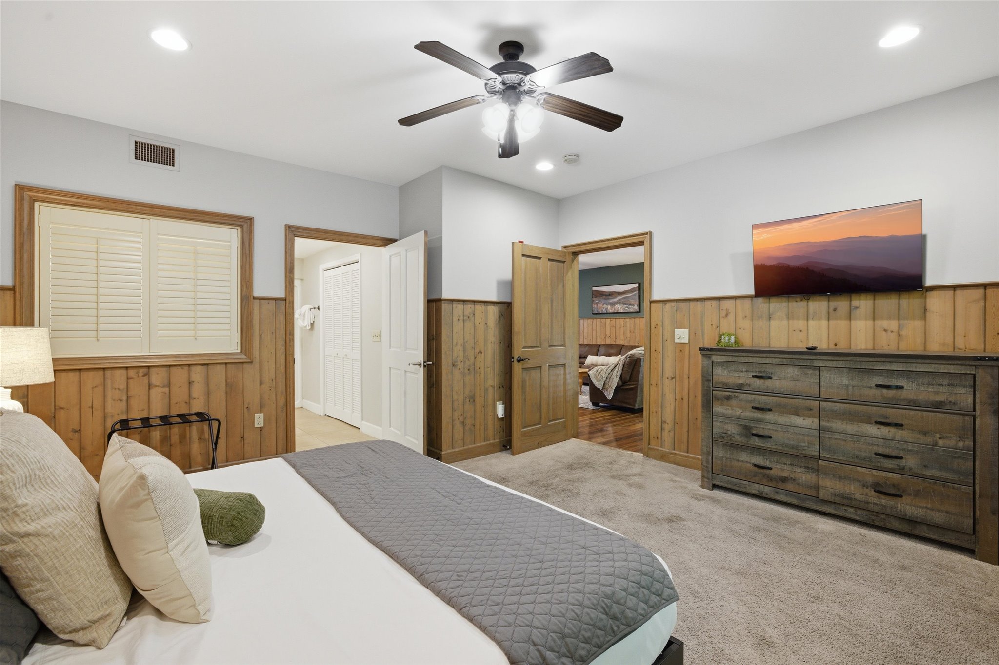 Relax and recharge in the spacious master suite in unit 312, featuring a king bed and a peaceful atmosphere—your own private place to wind down after exploring the Smokies.