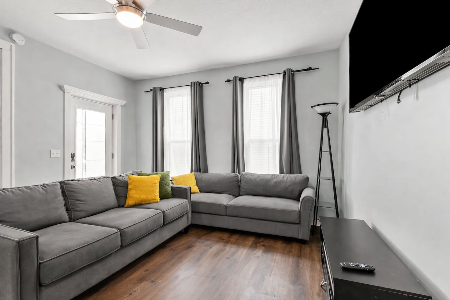 Enjoy downtime in the living room with plenty of seating, entertainment setup.