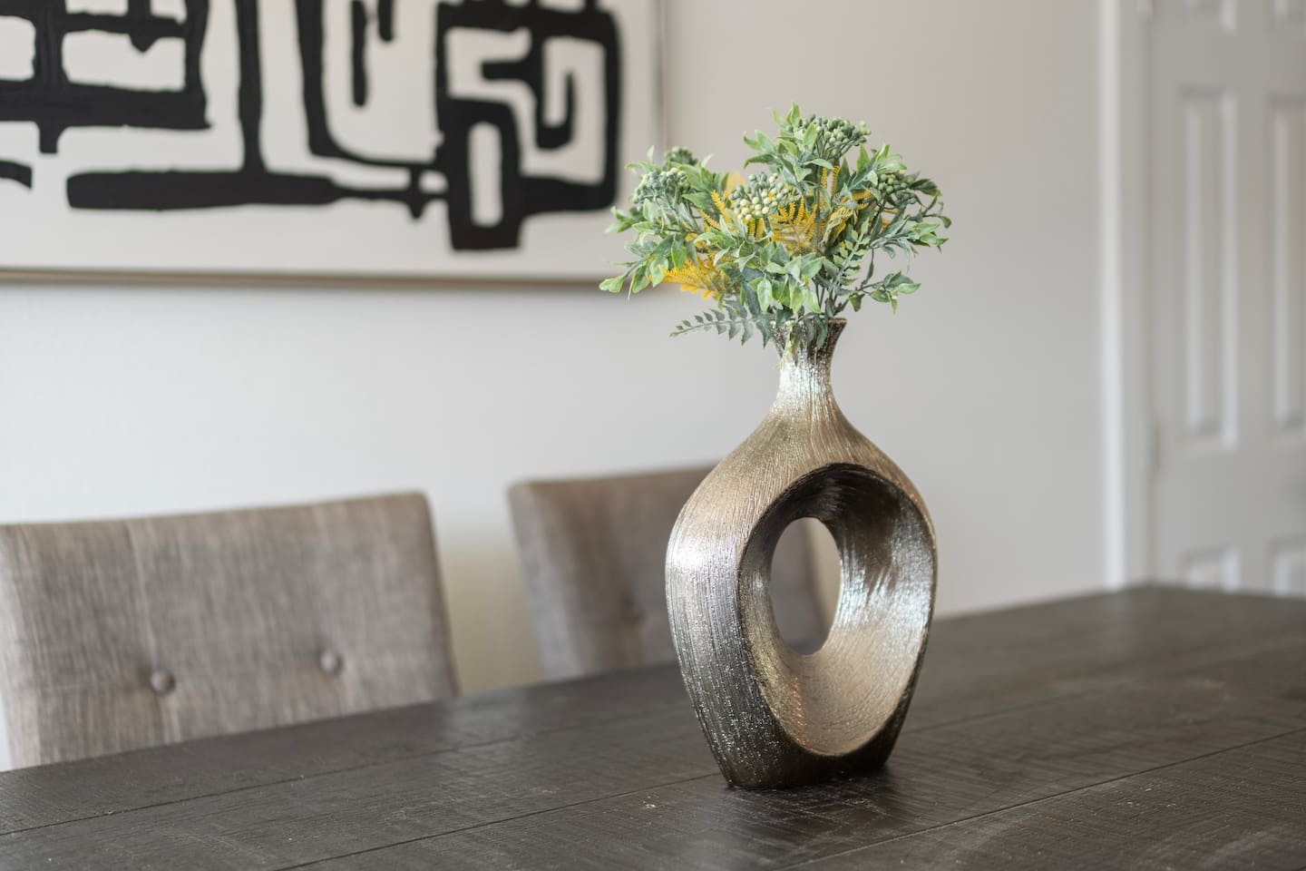 Open-concept dining space designed for connection. Seats six comfortably and flows seamlessly into the kitchen and living room.