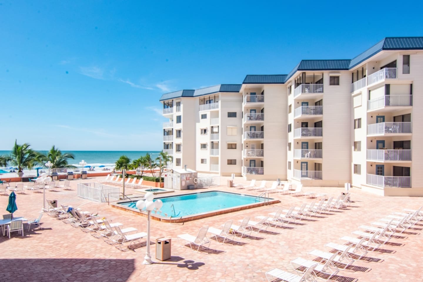 Heated Pool & Hot Tub open year round with ample seating, overlooking Gulf of Mexico.