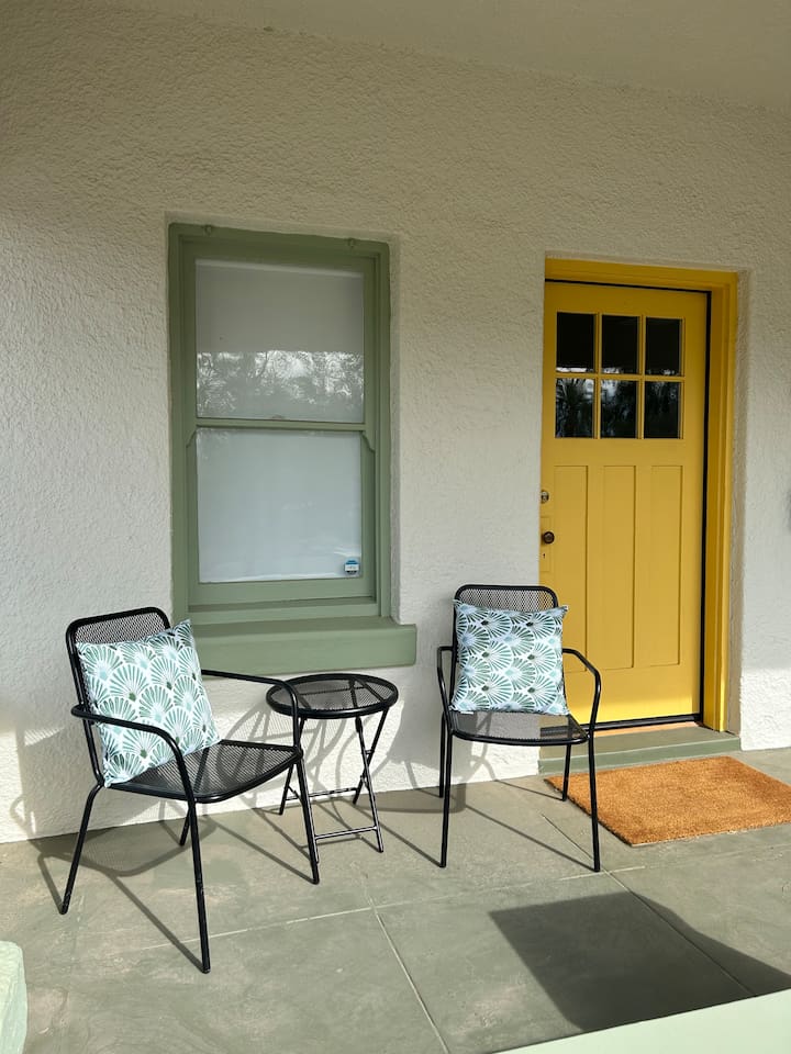 Front porch with chairs facing the sunset