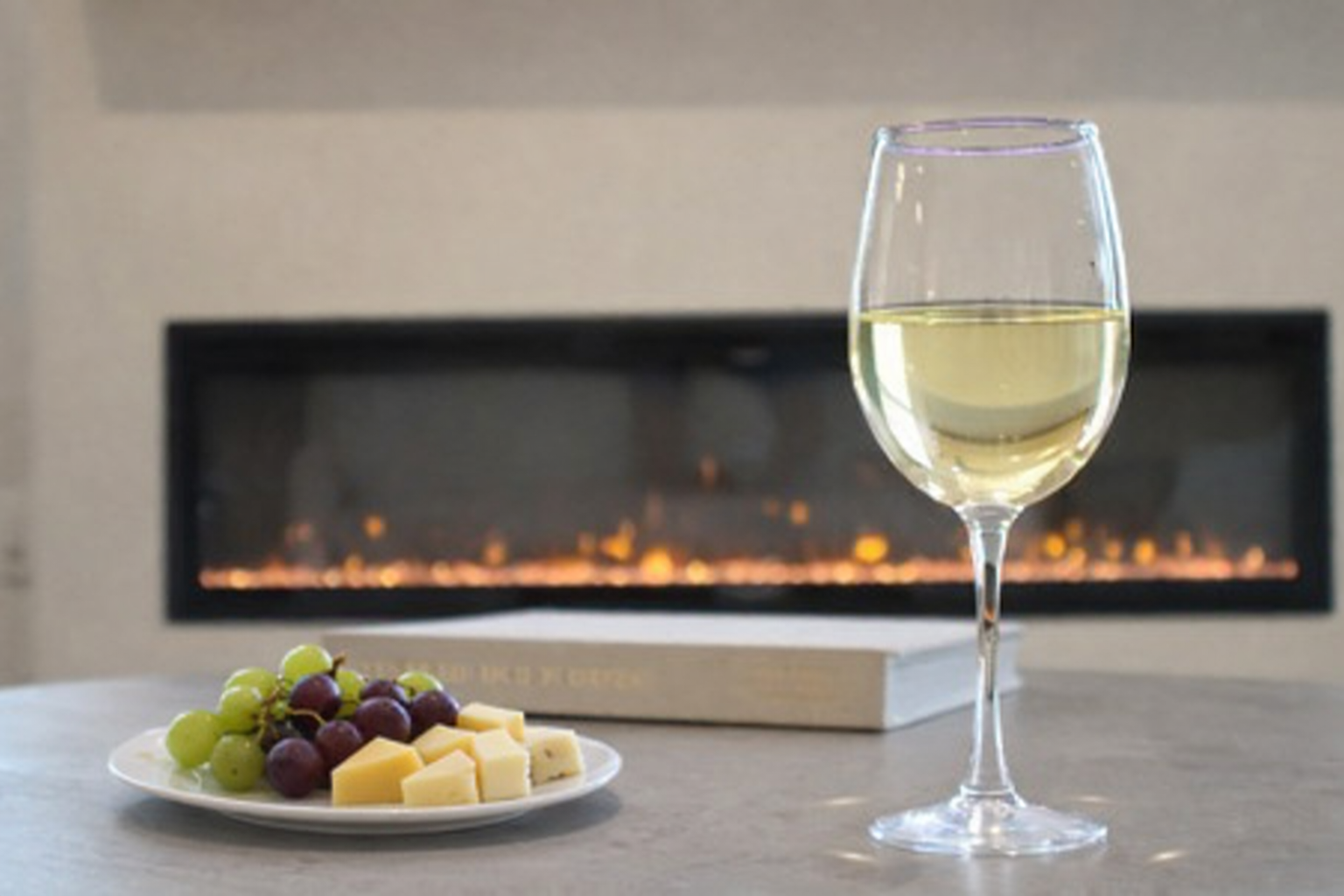 Settle in for a romantic night on the comfortable sofa in front of the electric fireplace or watch your favorite movie on the 70" TV.